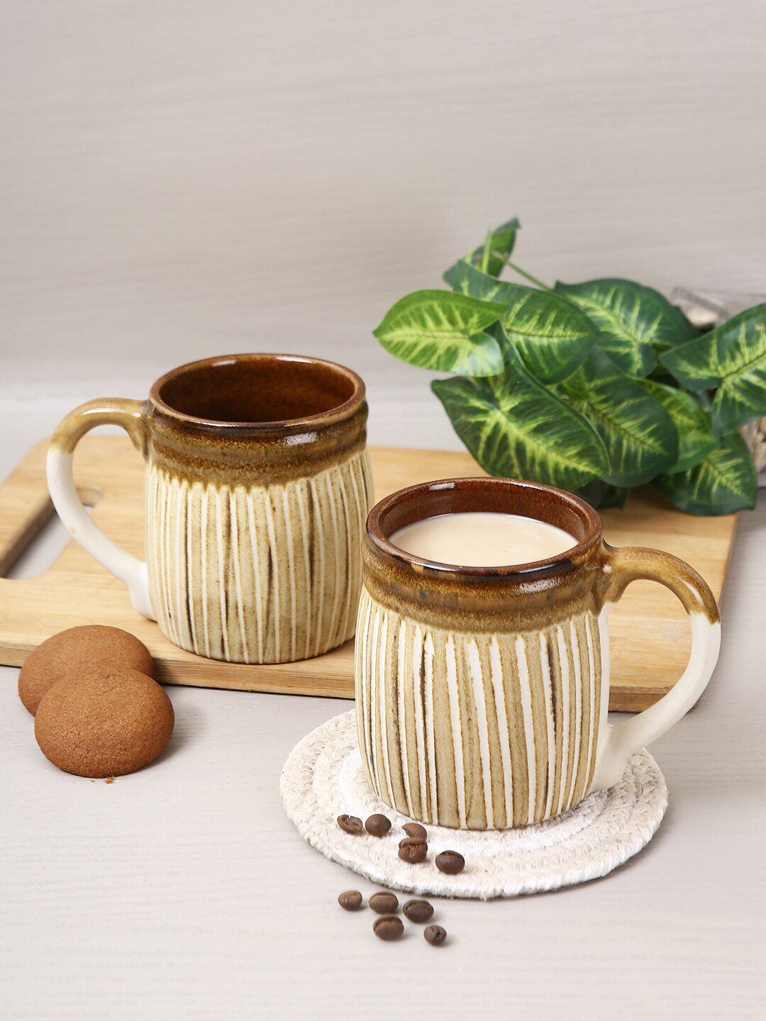 Aapno Rajasthan Set Of 4 Beige & Brown Textured Ceramic Glossy Mugs Price in India