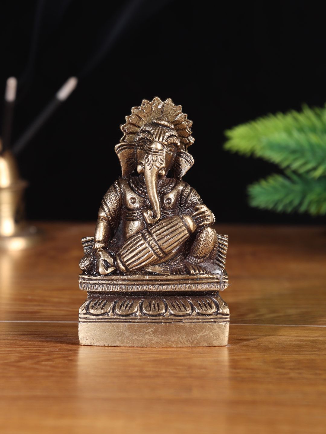 Aapno Rajasthan Brown Lord Ganesha Sitting On Throne Showpiece Price in India