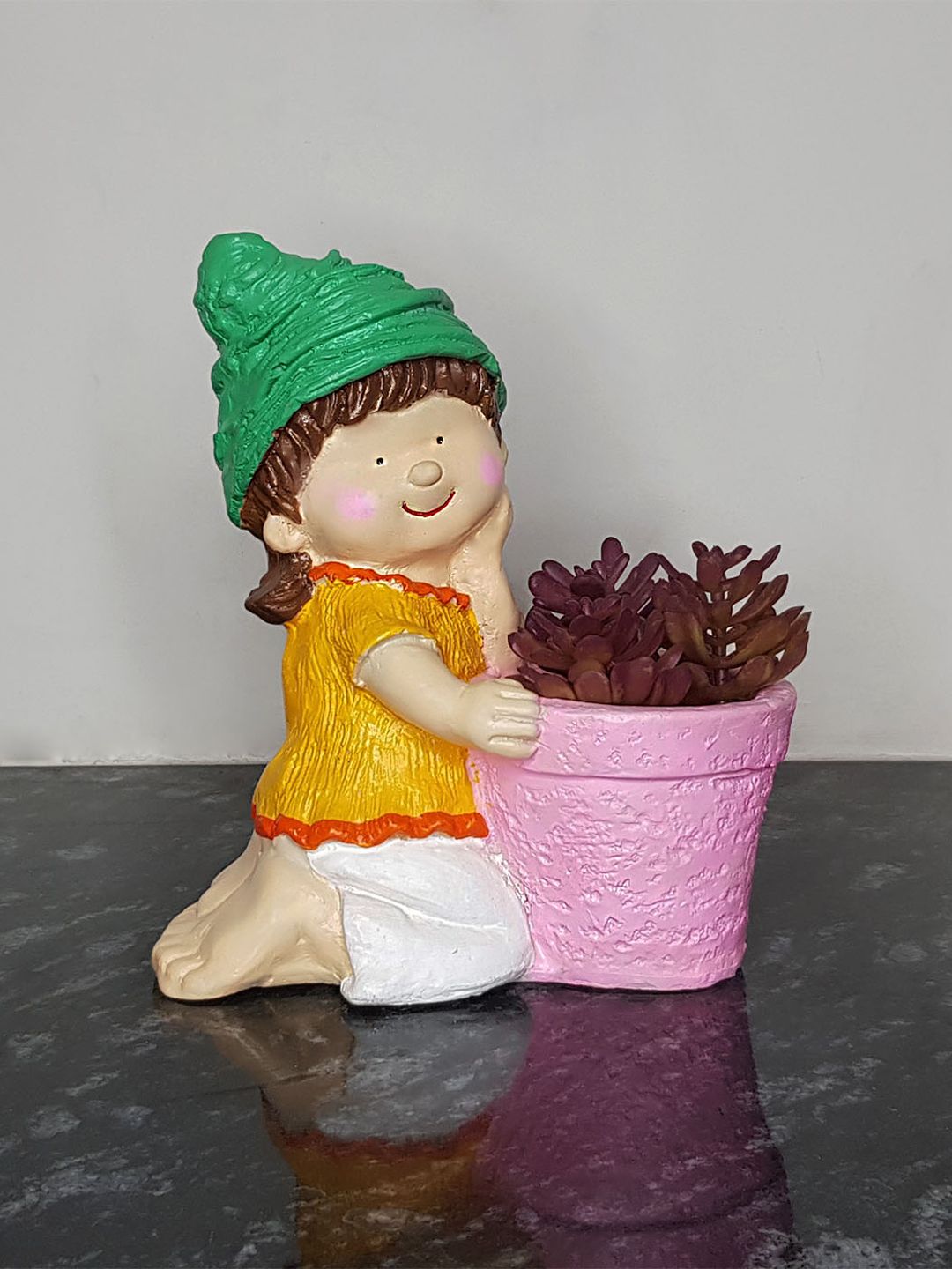 Wonderland Pink & Yellow Polyresin Girl With Planter Price in India