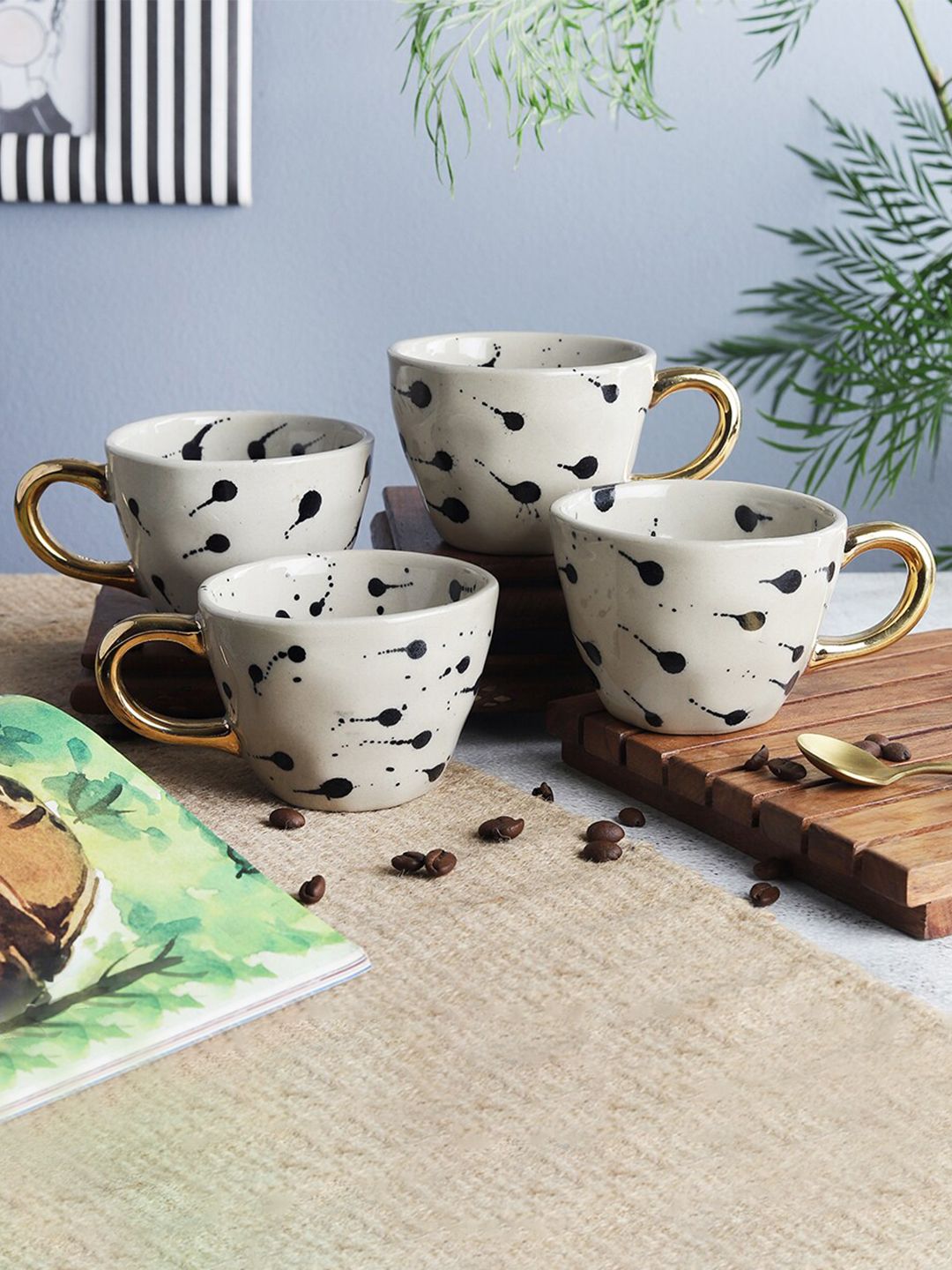 The Decor Mart Off White & Black Printed 4 Ceramic Glossy Cups Set Price in India