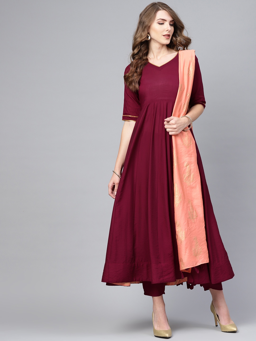 Libas Women Burgundy & Peach-Coloured Solid Anarkali Kurta with Trousers & Dupatta
Libas Women Burgundy & Peach-Coloured Solid Anarkali Kurta with Trousers & Dupatta