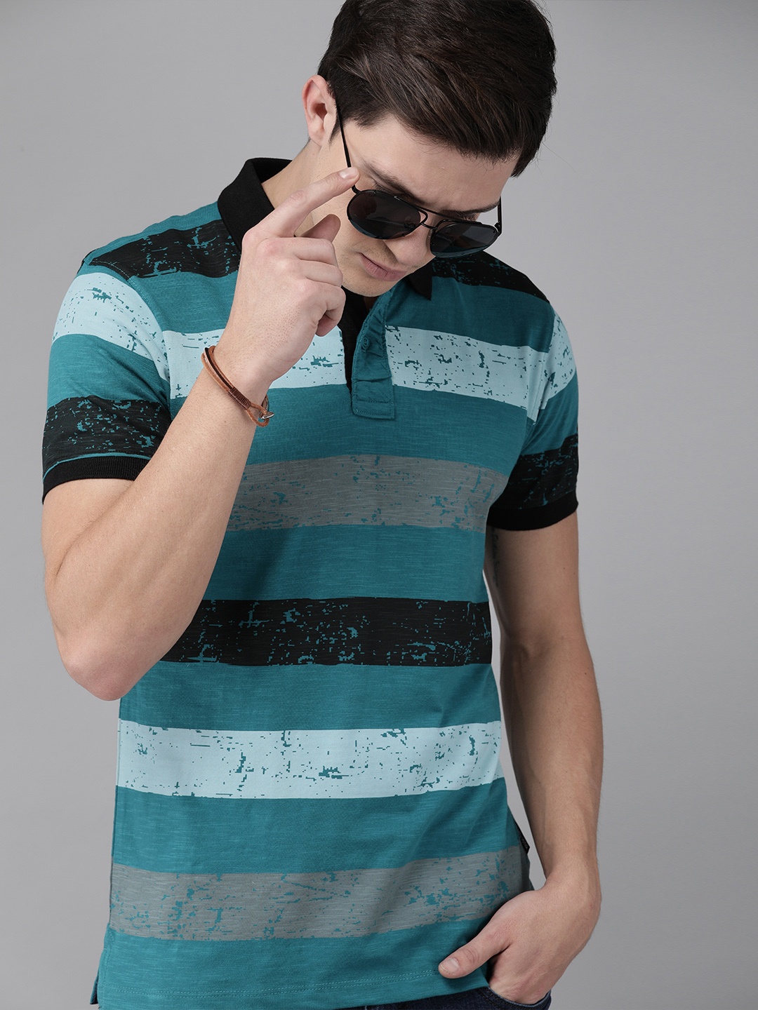 The Roadster Lifestyle Co Men Teal Blue Black Striped Polo Collar Pure Cotton T-shirt
The Roadster Lifestyle Co Men Teal Blue Black Striped Polo Collar Pure Cotton T-shirt