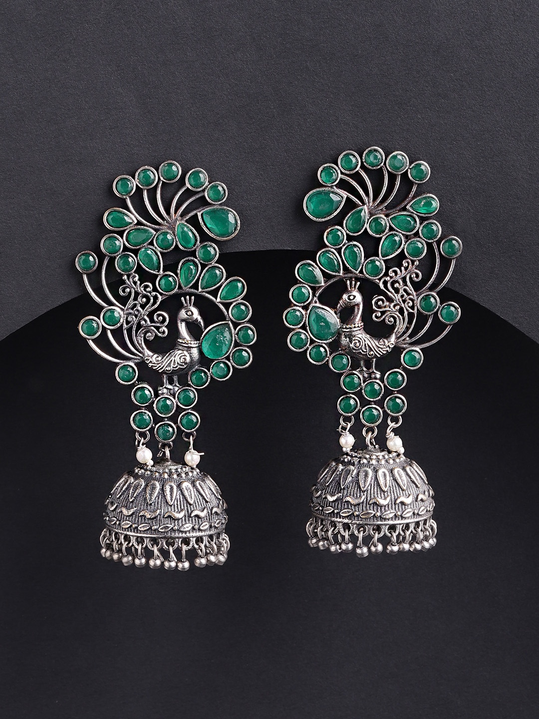 Priyaasi Oxidised Green German Silver-Plated Stone Studded Peacock Shaped Jhumkas
Priyaasi Oxidised Green German Silver-Plated Stone Studded Peacock Shaped Jhumkas