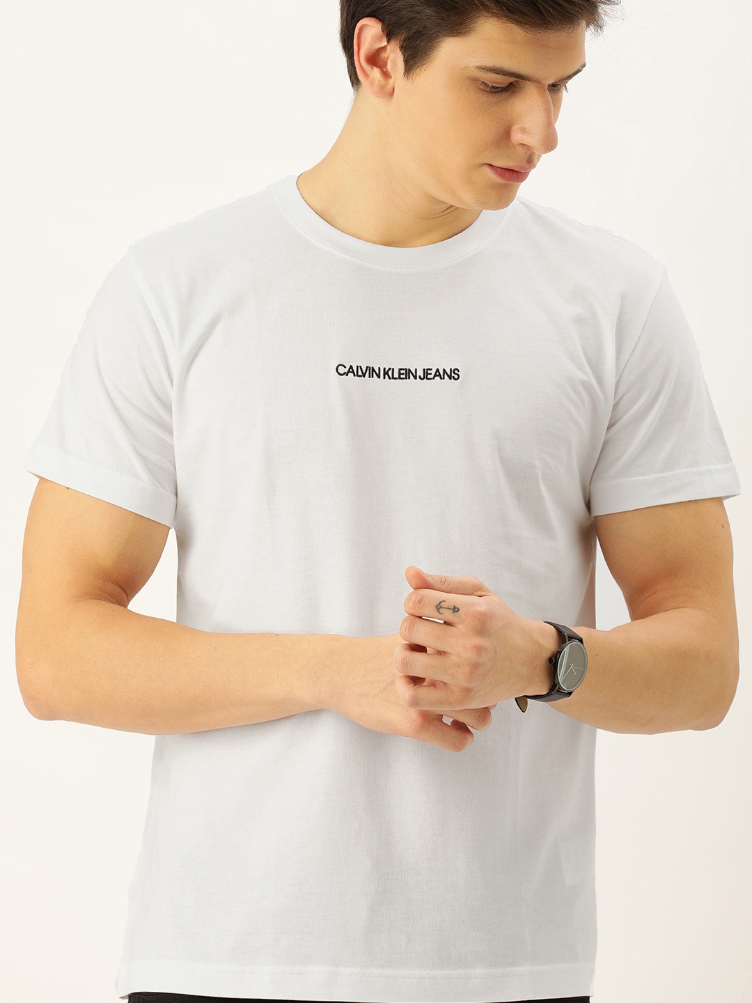 Calvin Klein Jeans Men White Solid Round Neck Pure Cotton T-shirt with Embroidered Detail
Calvin Klein Jeans Men White Solid Round Neck Pure Cotton T-shirt with Embroidered Detail