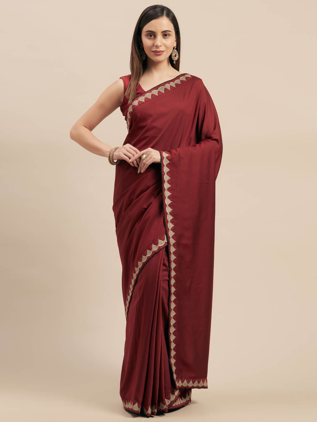 Mitera Maroon Solid Silk Blend Saree 
Mitera Maroon Solid Silk Blend Saree