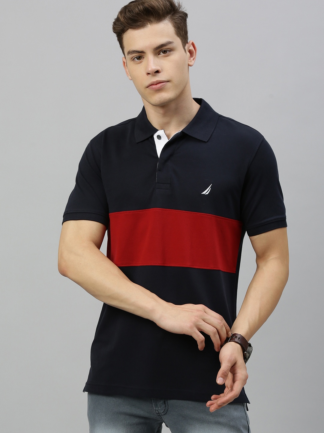 Nautica Men Navy Blue & Red Colourblocked Polo Collar Regular Sleeves Embroidered T-shirt
Nautica Men Navy Blue & Red Colourblocked Polo Collar Regular Sleeves Embroidered T-shirt