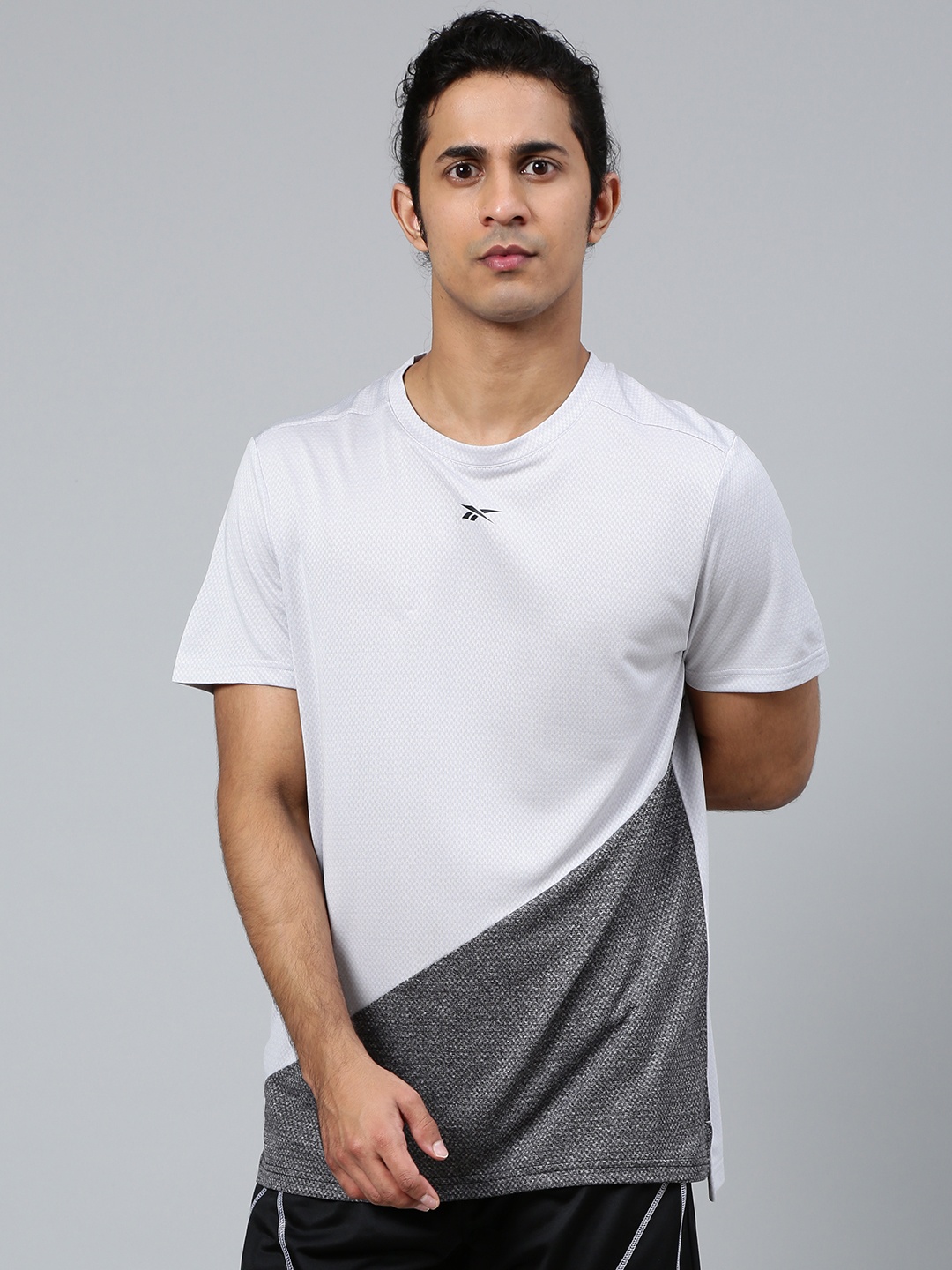 Reebok Men White Charcoal Grey Colourblocked Workout Ready Melange Pure Cotton T-shirt
Reebok Men White Charcoal Grey Colourblocked Workout Ready Melange Pure Cotton T-shirt