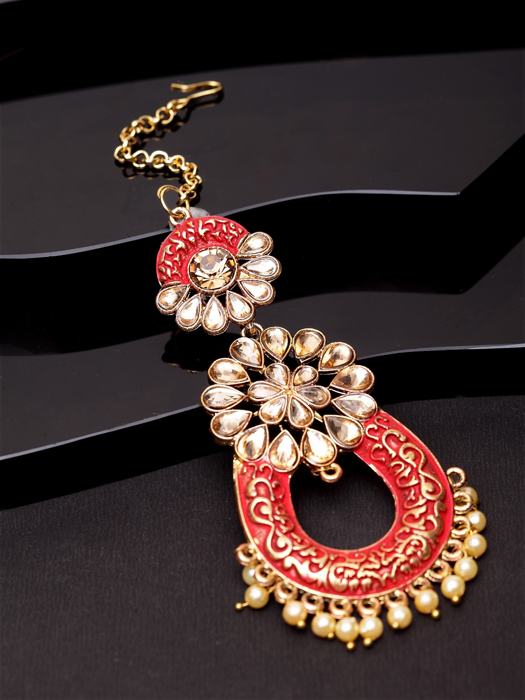ANIKAS CREATION Gold-Plated & Coral Red Stone Studded Enameled Hand Painted Maang Tikka
ANIKAS CREATION Gold-Plated & Coral Red Stone Studded Enameled Hand Painted Maang Tikka