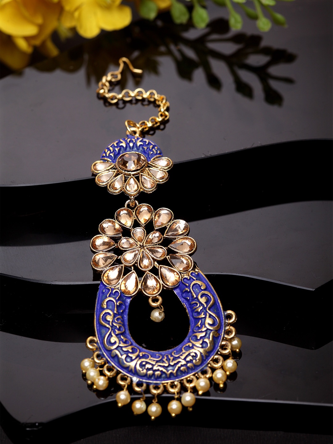 ANIKAS CREATION Gold-Plated & Blue Stone Studded Enameled Hand Painted Traditional Maang Tikka
ANIKAS CREATION Gold-Plated & Blue Stone Studded Enameled Hand Painted Traditional Maang Tikka