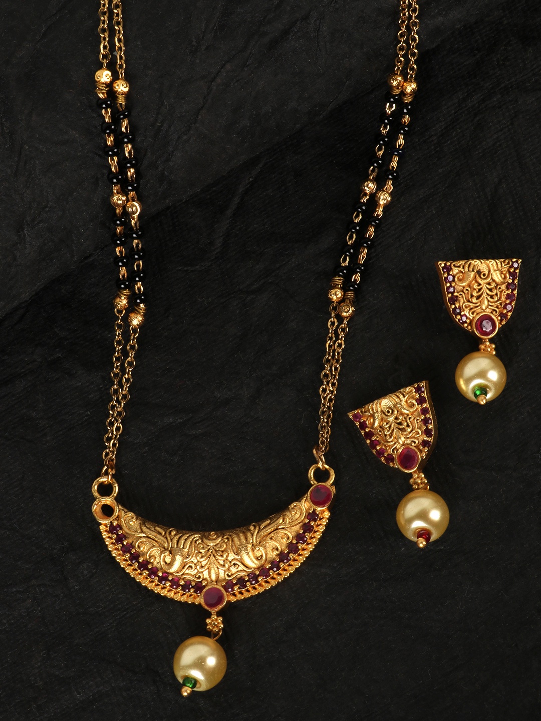 JEWELS GEHNA Black & Pink Gold-Plated Stone-Studded & Beaded Mangalsutra & Earrings Set
JEWELS GEHNA Black & Pink Gold-Plated Stone-Studded & Beaded Mangalsutra & Earrings Set