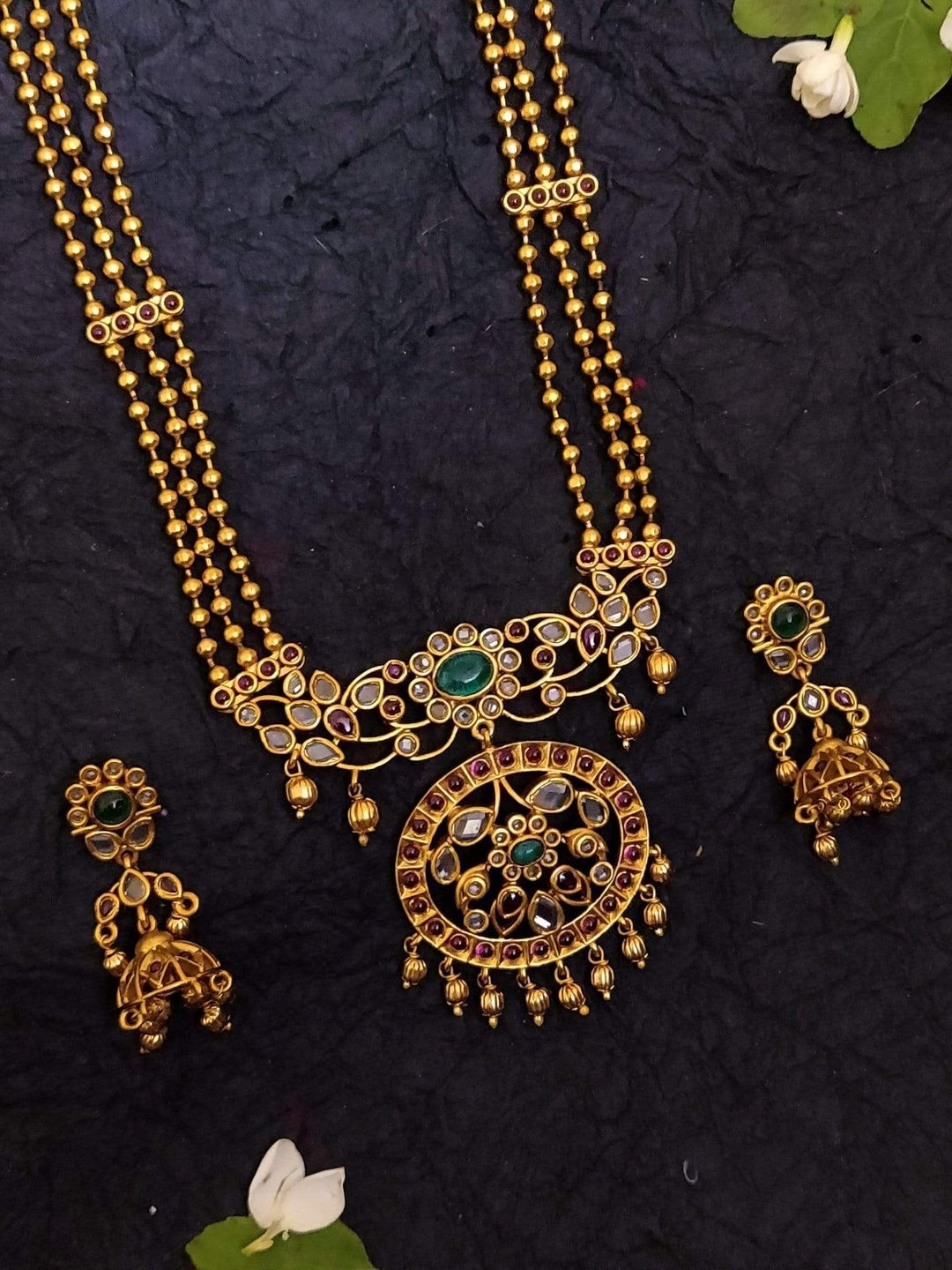 Rubans Gold-Plated Green & Red Faux Ruby & Emerald-Studded Handcrafted Temple Jewellery Set
Rubans Gold-Plated Green & Red Faux Ruby & Emerald-Studded Handcrafted Temple Jewellery Set