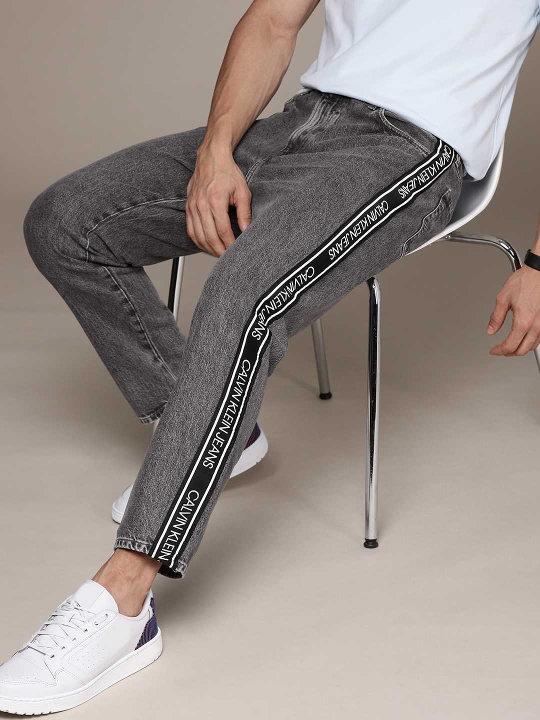Calvin Klein Jeans Men Grey Dad Fit Light Fade Mid Rise Jeans With Printed Side Stripes
Calvin Klein Jeans Men Grey Dad Fit Light Fade Mid Rise Jeans With Printed Side Stripes
