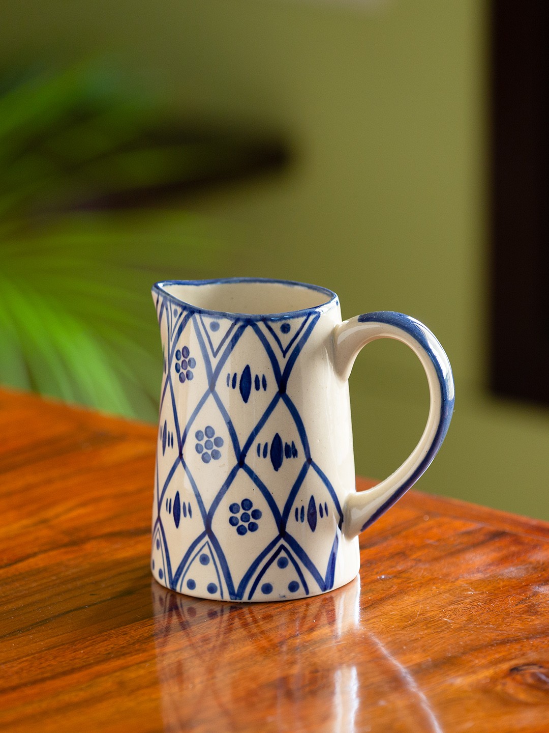 ExclusiveLane Moroccan Floral Hand-Painted Studio Pottery Ceramic Water Jug - 700 ml, White
ExclusiveLane Moroccan Floral Hand-Painted Studio Pottery Ceramic Water Jug - 700 ml, White