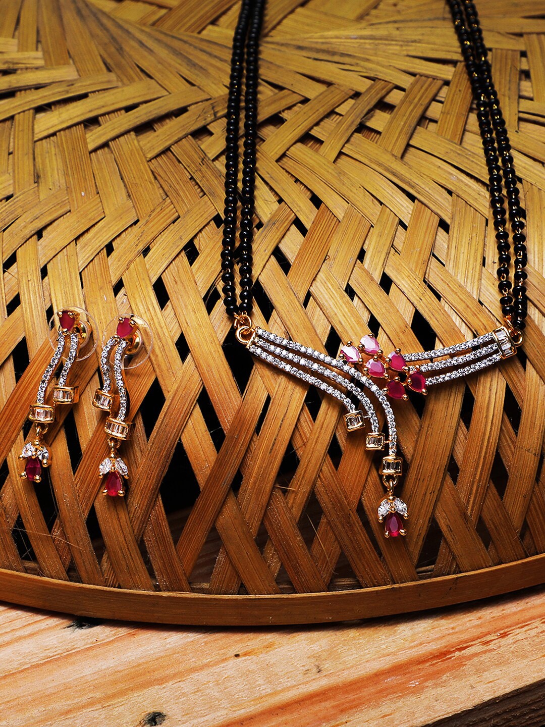 Adwitiya Collection Gold-Plated Black & White AD-Studded Beaded Mangalsutra with Earrings
Adwitiya Collection Gold-Plated Black & White AD-Studded Beaded Mangalsutra with Earrings