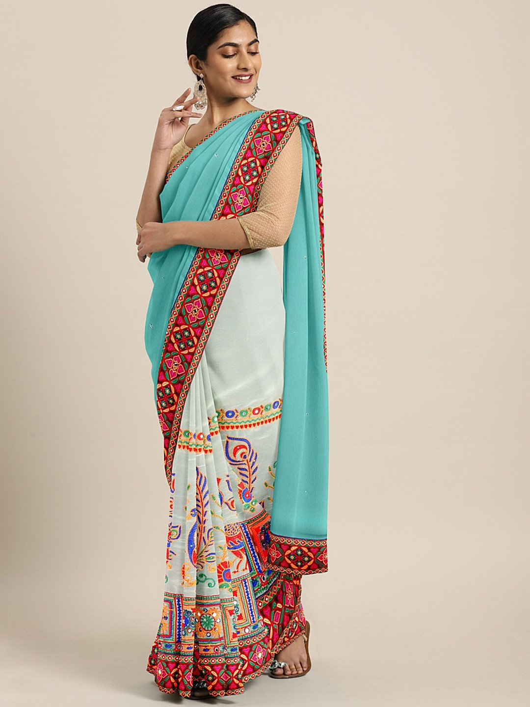 Mitera Turquoise Blue & White Heavy Kutchi Work With Peacock Design Embroidered Saree
Mitera Turquoise Blue & White Heavy Kutchi Work With Peacock Design Embroidered Saree
