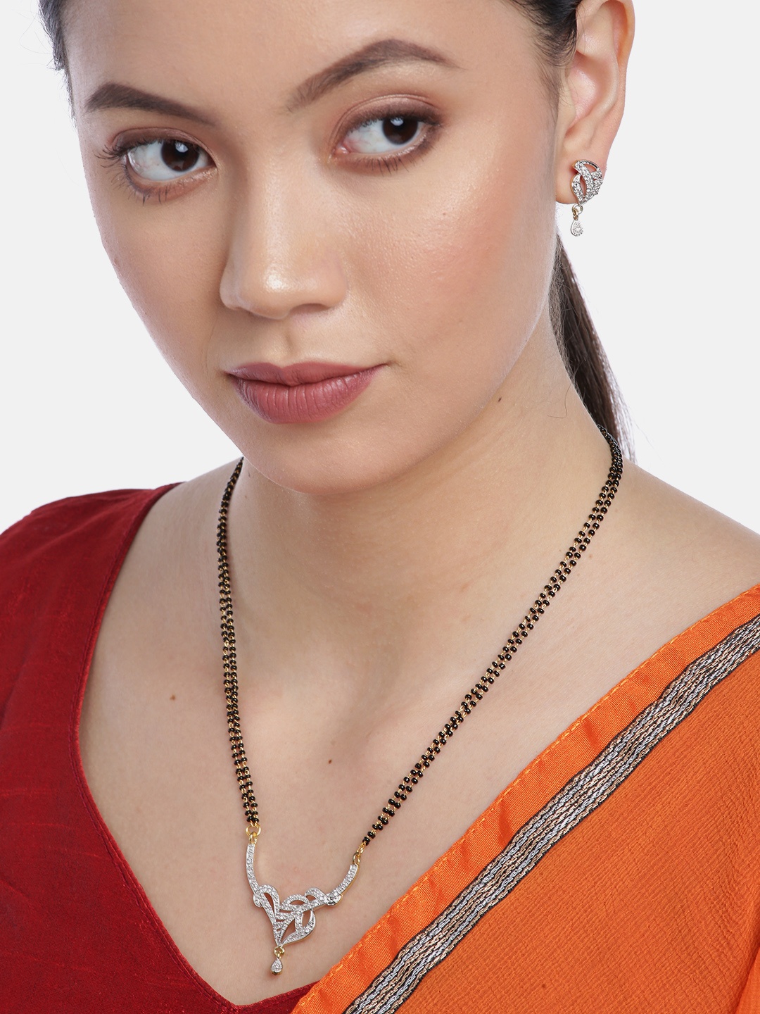 YouBella Black Gold-Plated Stone-Studded & Beaded Dual-Stranded Mangalsutra with Earrings
YouBella Black Gold-Plated Stone-Studded & Beaded Dual-Stranded Mangalsutra with Earrings