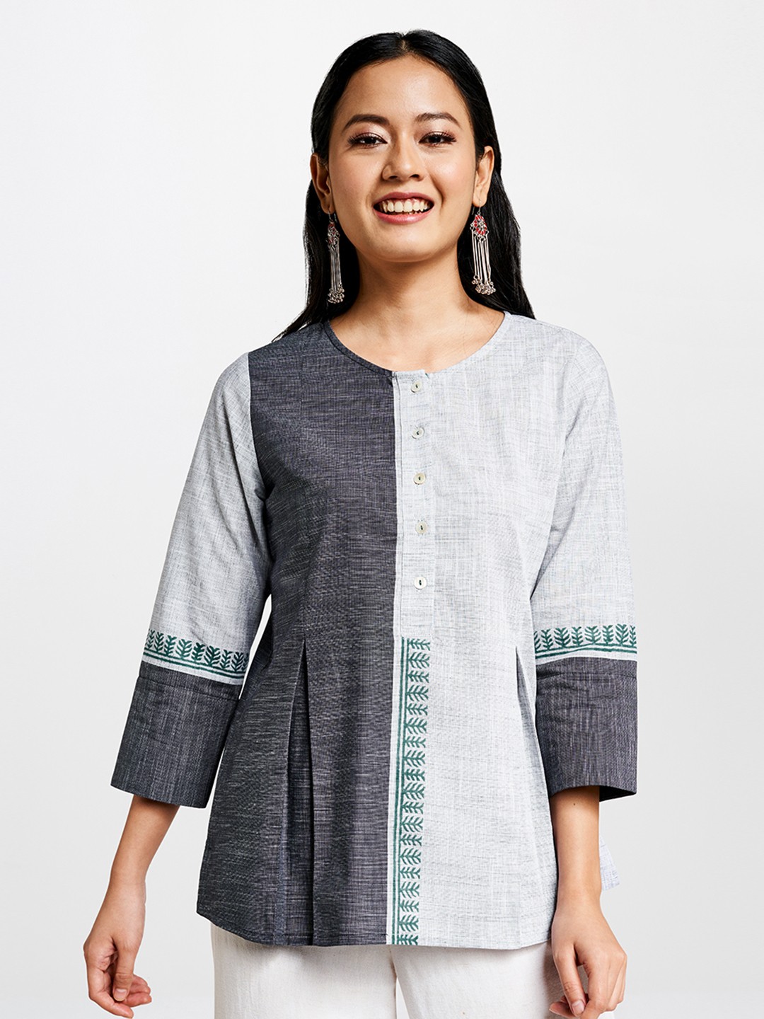 Global Desi Women Grey & White Colourblocked Longline A-Line Pure Cotton Top with Pleats
Global Desi Women Grey & White Colourblocked Longline A-Line Pure Cotton Top with Pleats