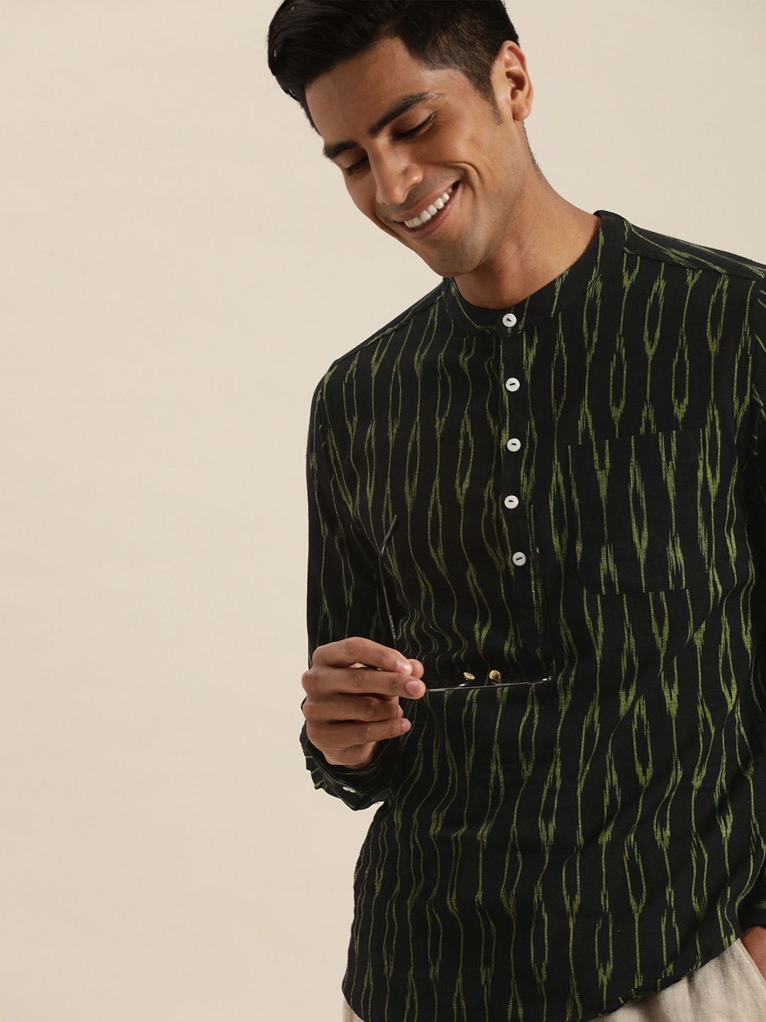 Taavi Men Black & Green Ikat Woven Design Straight Sustainable Kurta with Chest Pocket
Taavi Men Black & Green Ikat Woven Design Straight Sustainable Kurta with Chest Pocket