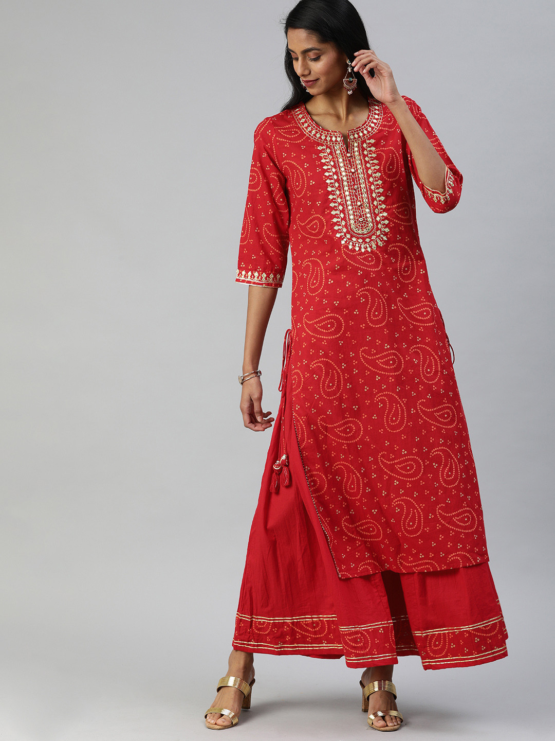 Ishin Women Red & White Bandhani Printed Kurta with Sharara
Ishin Women Red & White Bandhani Printed Kurta with Sharara