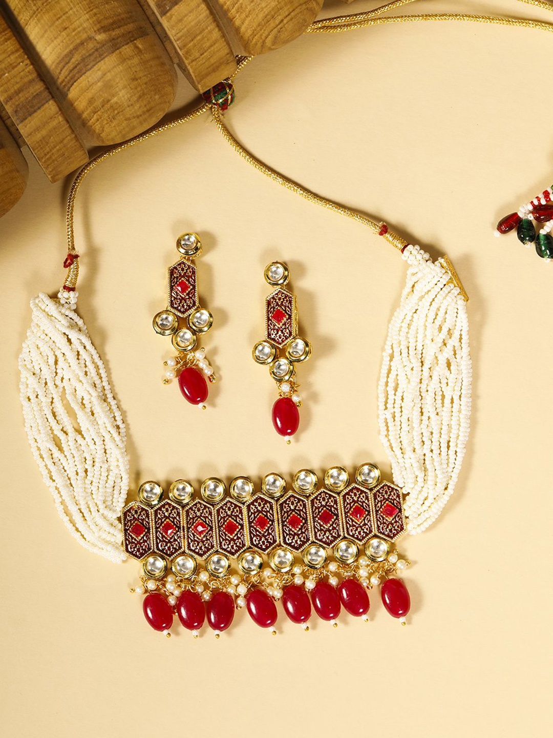 Priyaasi Red Gold-Plated Ruby Studded & Beaded Handcrafted Enamelled Jewellery Set
Priyaasi Red Gold-Plated Ruby Studded & Beaded Handcrafted Enamelled Jewellery Set