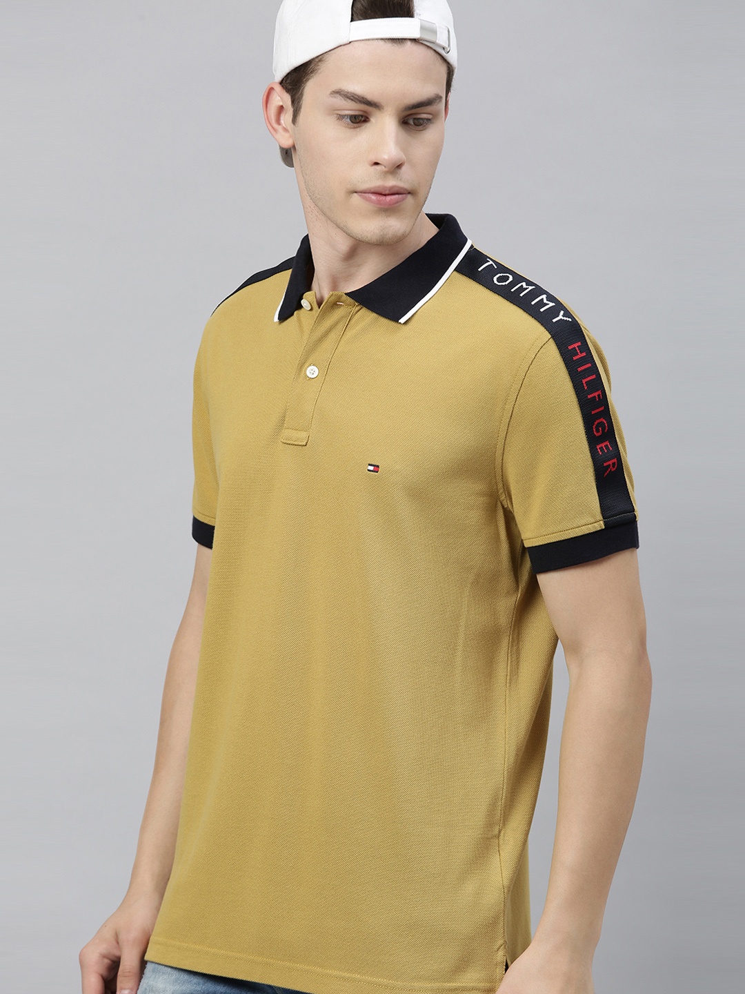 Tommy Hilfiger Men Mustard Yellow Solid Polo Collar Pure Cotton T-shirt with Taping Detail
Tommy Hilfiger Men Mustard Yellow Solid Polo Collar Pure Cotton T-shirt with Taping Detail
