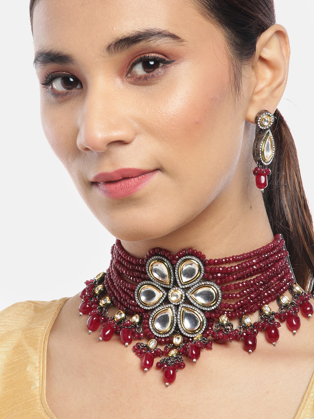 Priyaasi Maroon Gold-Plated Kundan Studded & Beaded Handcrafted Choker Jewellery Set
Priyaasi Maroon Gold-Plated Kundan Studded & Beaded Handcrafted Choker Jewellery Set