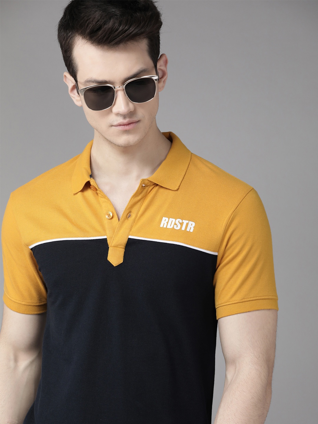 Roadster Men Navy Blue & Mustard Yellow Colourblocked Polo Collar Pure Cotton T-shirt
Roadster Men Navy Blue & Mustard Yellow Colourblocked Polo Collar Pure Cotton T-shirt