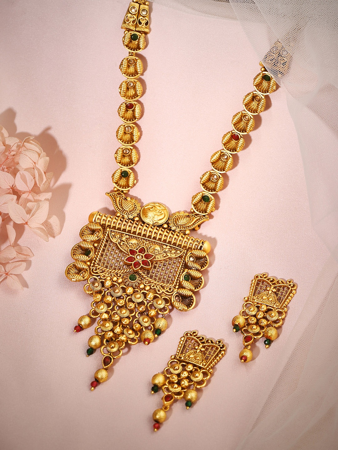 Rubans 24K Gold Plated Ruby and Emerald Studded Golden Beaded Traditional Necklace Set
Rubans 24K Gold Plated Ruby and Emerald Studded Golden Beaded Traditional Necklace Set