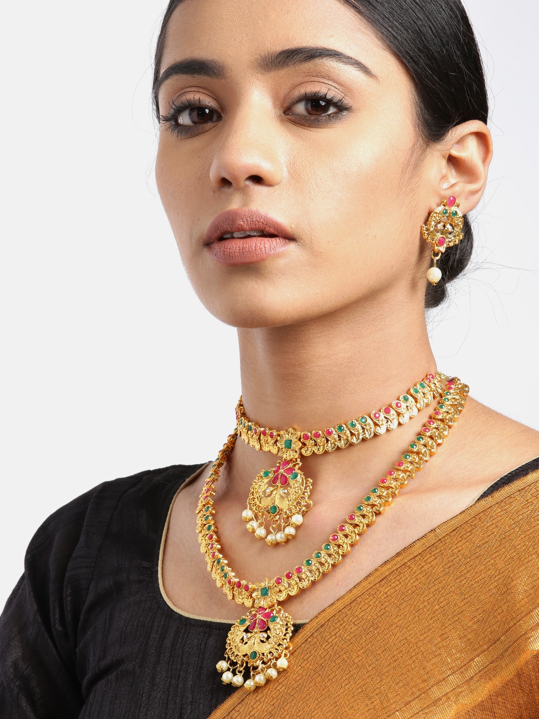 YouBella Green & Magenta Gold-Plated Stone Studded & Beaded Peacock Shaped Jewellery Set
YouBella Green & Magenta Gold-Plated Stone Studded & Beaded Peacock Shaped Jewellery Set