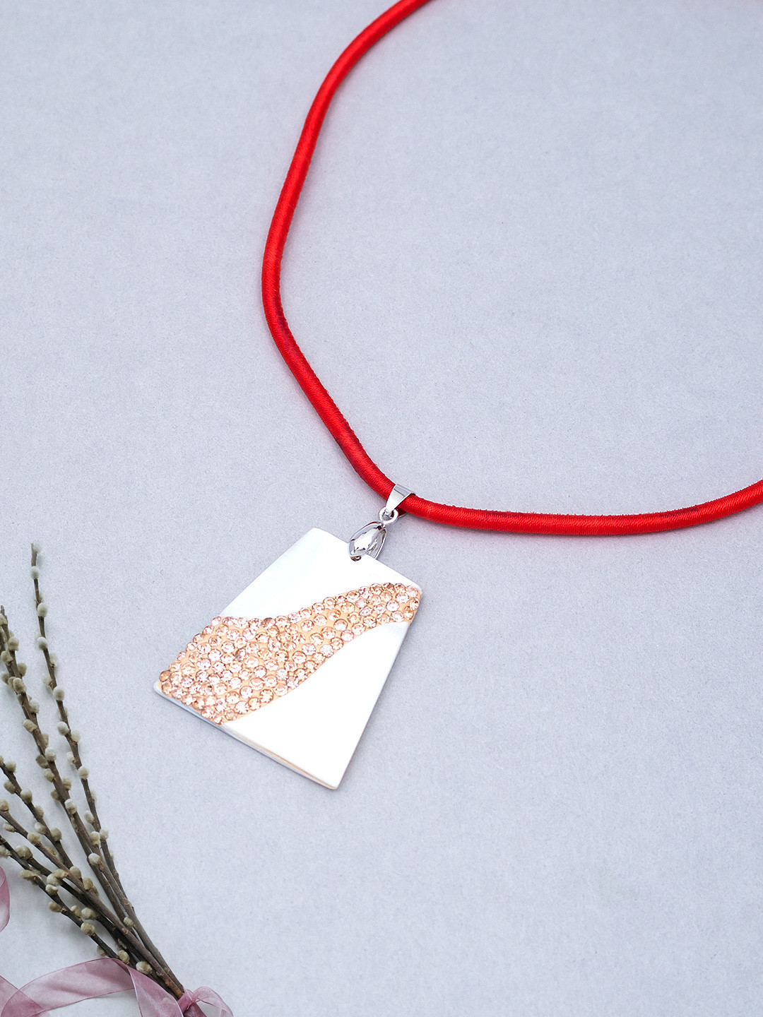 Golden Peacock Off-White & Peach-Coloured Stone-Studded Trapezium Pendant with Nylon Cord
Golden Peacock Off-White & Peach-Coloured Stone-Studded Trapezium Pendant with Nylon Cord