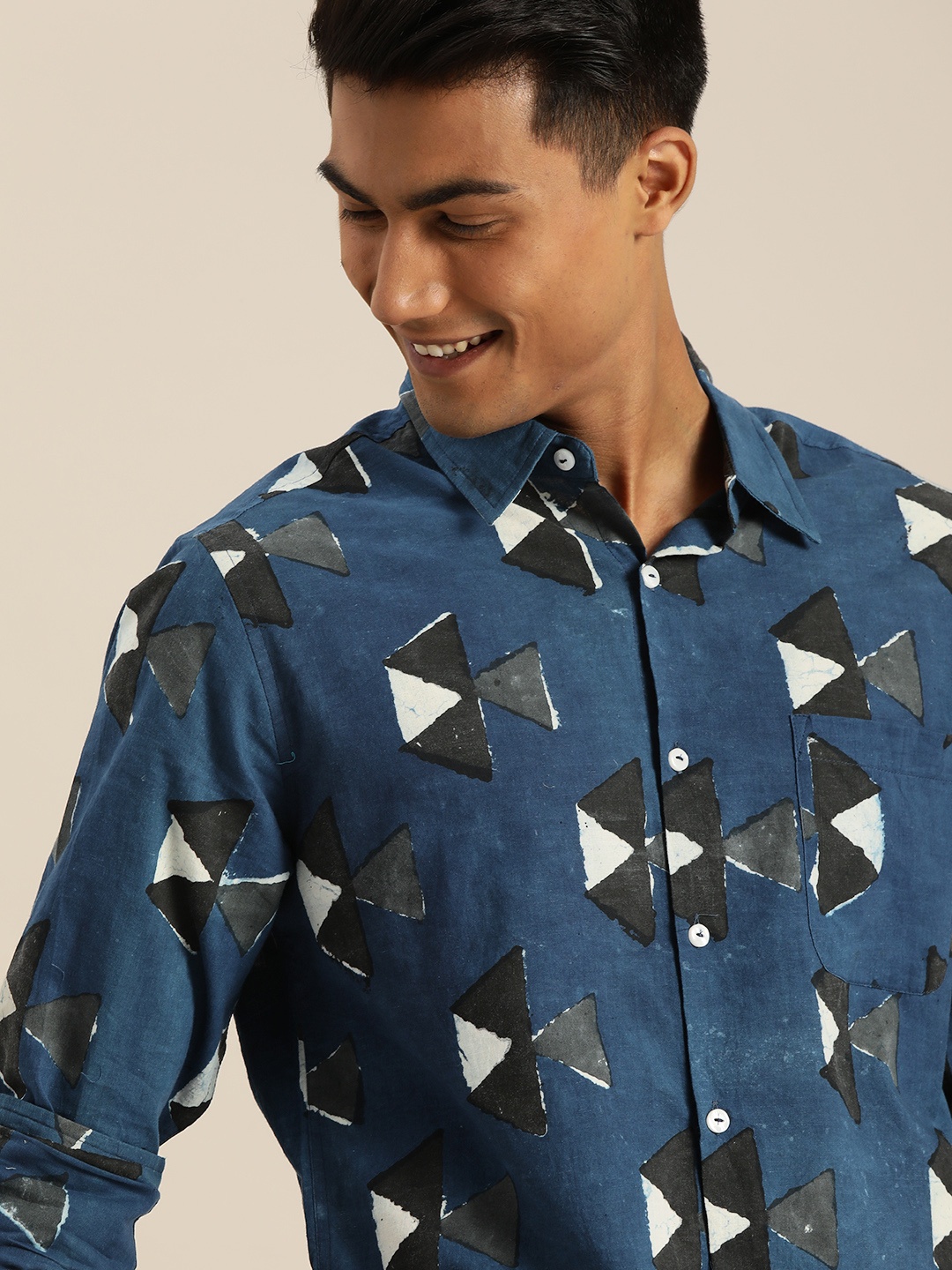 Taavi Men Blue & Black Regular Fit Indigo Hand Block Printed Sustainable Shirt with Pocket
Taavi Men Blue & Black Regular Fit Indigo Hand Block Printed Sustainable Shirt with Pocket