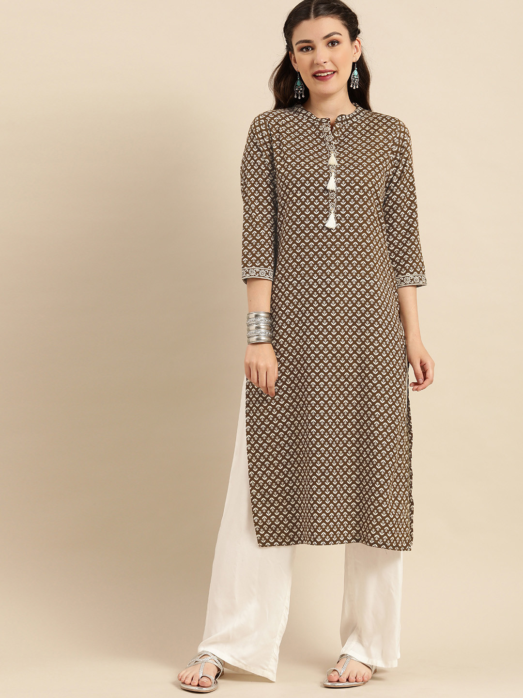 Rajnandini Women Brown & Beige Floral Printed Pure Cambric Cotton Sequins Kurta
Rajnandini Women Brown & Beige Floral Printed Pure Cambric Cotton Sequins Kurta