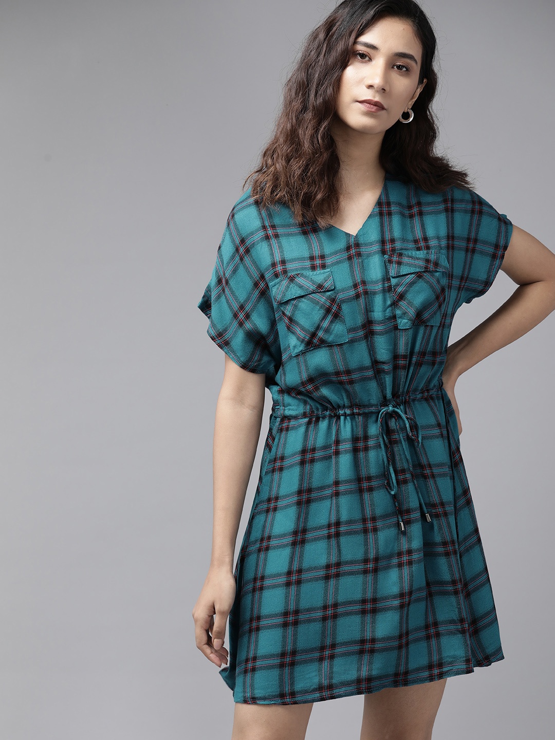 The Roadster Lifestyle Co Women ECOVERO Teal Blue & Black Checked A-Line Dress with Waist Tie-Ups
The Roadster Lifestyle Co Women ECOVERO Teal Blue & Black Checked A-Line Dress with Waist Tie-Ups