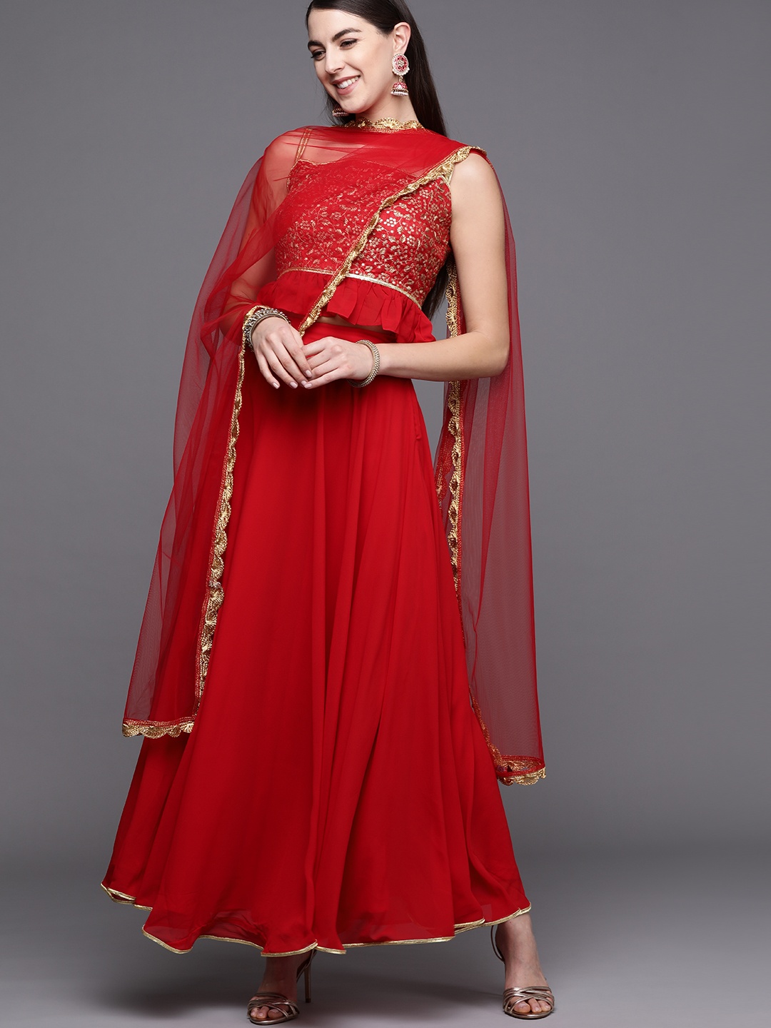 Inddus Red & Golden Embroidered Semi-Stitched Lehenga & Unstitched Blouse with Dupatta
Inddus Red & Golden Embroidered Semi-Stitched Lehenga & Unstitched Blouse with Dupatta