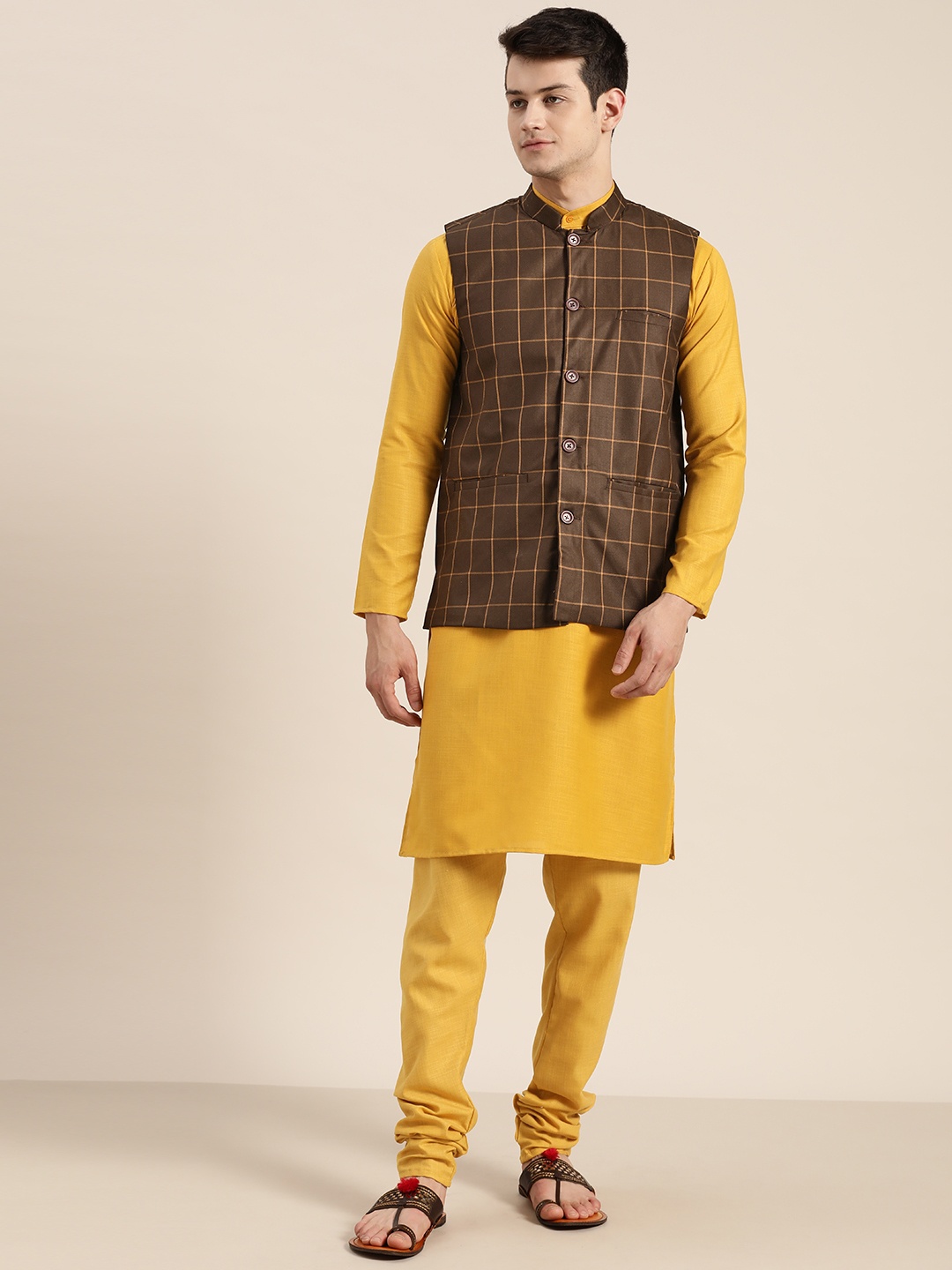 SOJANYA Men Mustard Yellow & Coffee Brown Solid Kurta with Churidar With Nehru Jacket
SOJANYA Men Mustard Yellow & Coffee Brown Solid Kurta with Churidar With Nehru Jacket