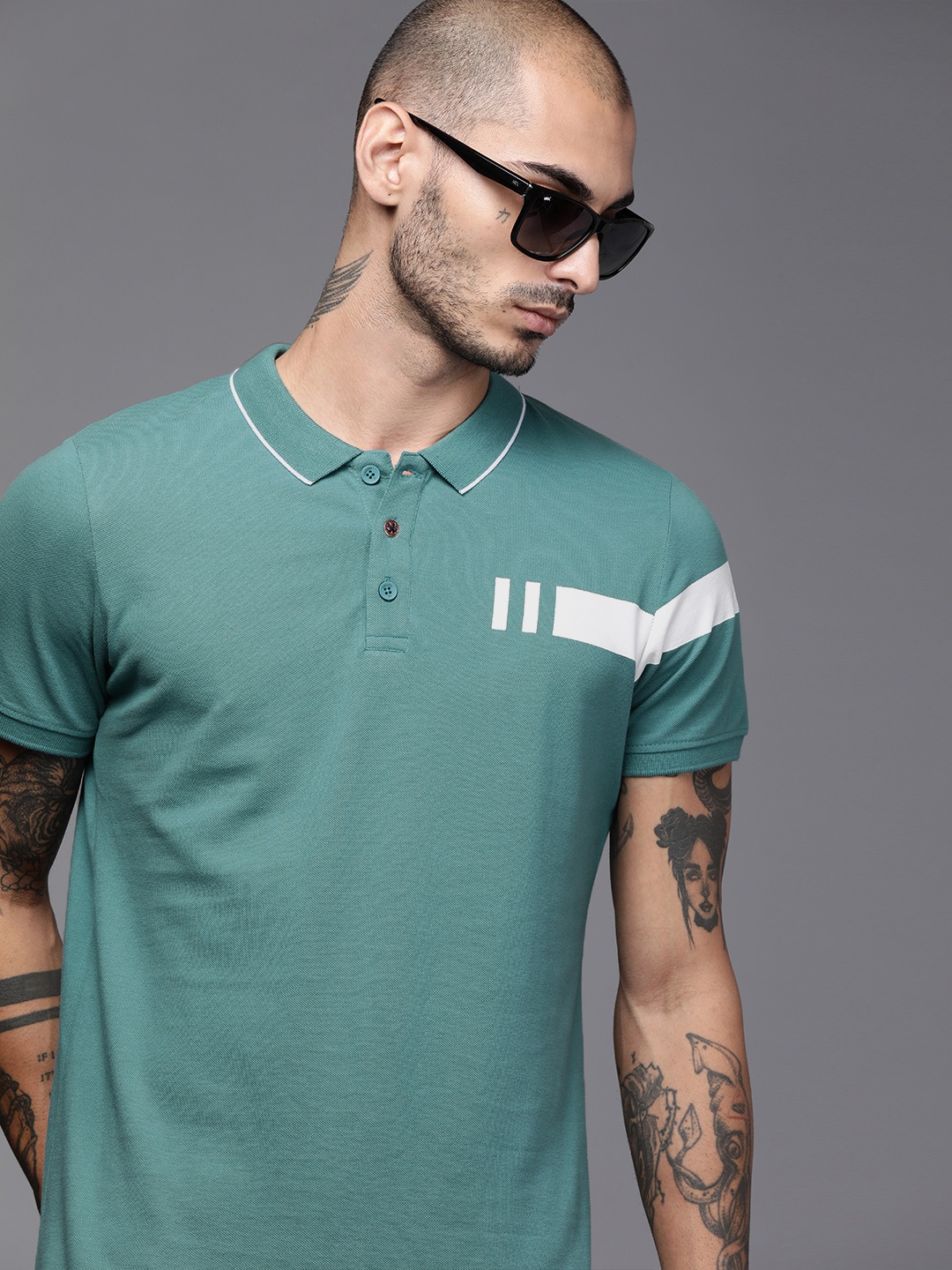 WROGN Men Teal Green Slim Fit Solid Polo Collar Pure Cotton T-shirt with Printed Detail
WROGN Men Teal Green Slim Fit Solid Polo Collar Pure Cotton T-shirt with Printed Detail