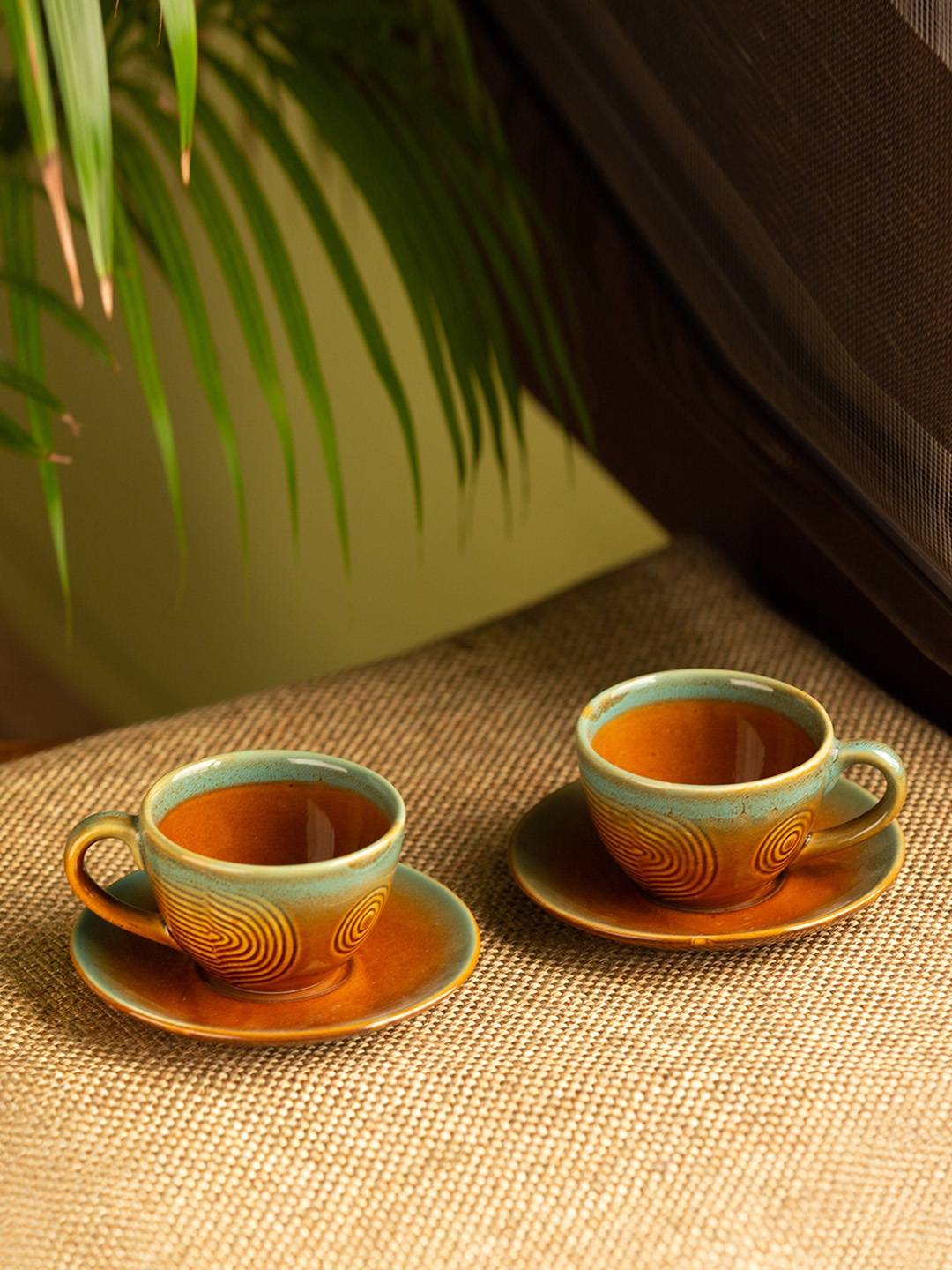 ExclusiveLane Set of 2 Brown Sea Green Hand-Engraved Ceramic Cup & Saucer Set-180 ml
ExclusiveLane Set of 2 Brown Sea Green Hand-Engraved Ceramic Cup & Saucer Set-180 ml