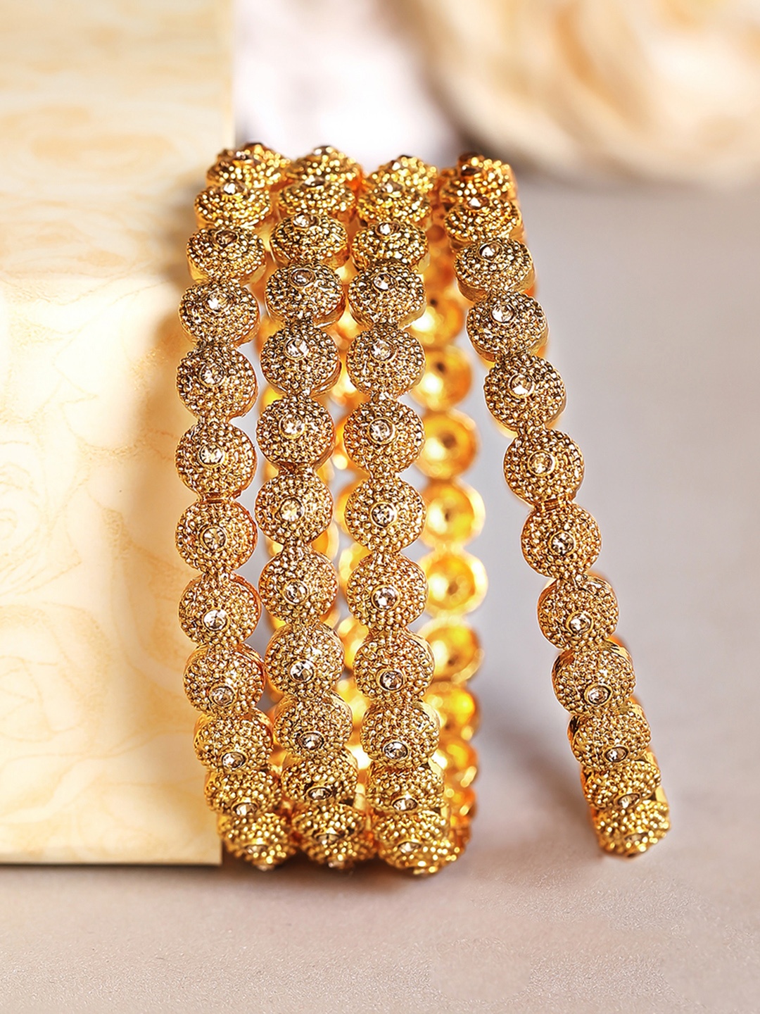 Rubans Set Of 4 24K Gold-Plated & Beige Shampain-Studded Filigree Handcrafted Bangles
Rubans Set Of 4 24K Gold-Plated & Beige Shampain-Studded Filigree Handcrafted Bangles