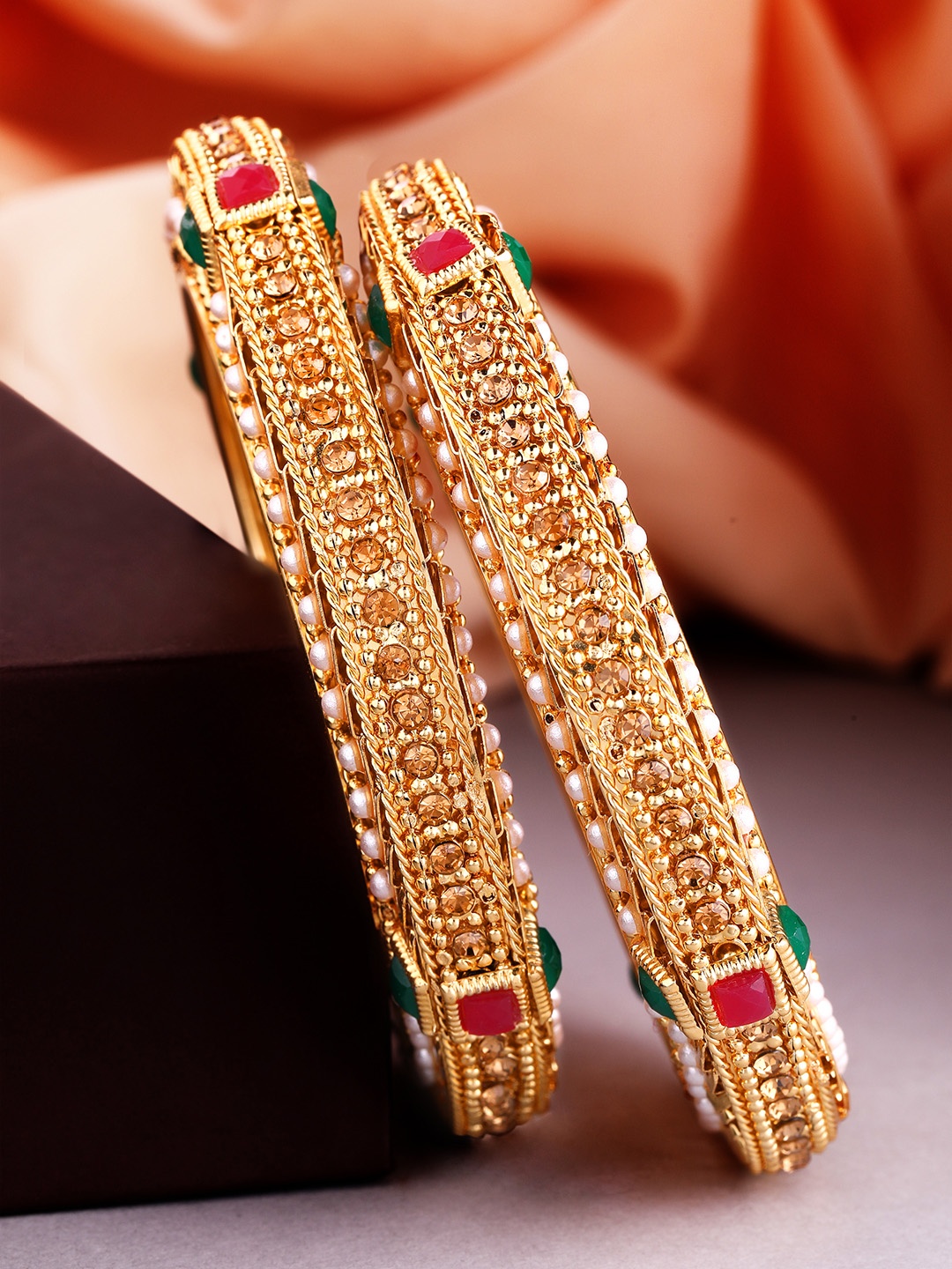 Rubans Set of 2 24K Gold-Plated Pink & Green Ruby-Studded & Pearl-Studded Handcrafted Bangles
Rubans Set of 2 24K Gold-Plated Pink & Green Ruby-Studded & Pearl-Studded Handcrafted Bangles