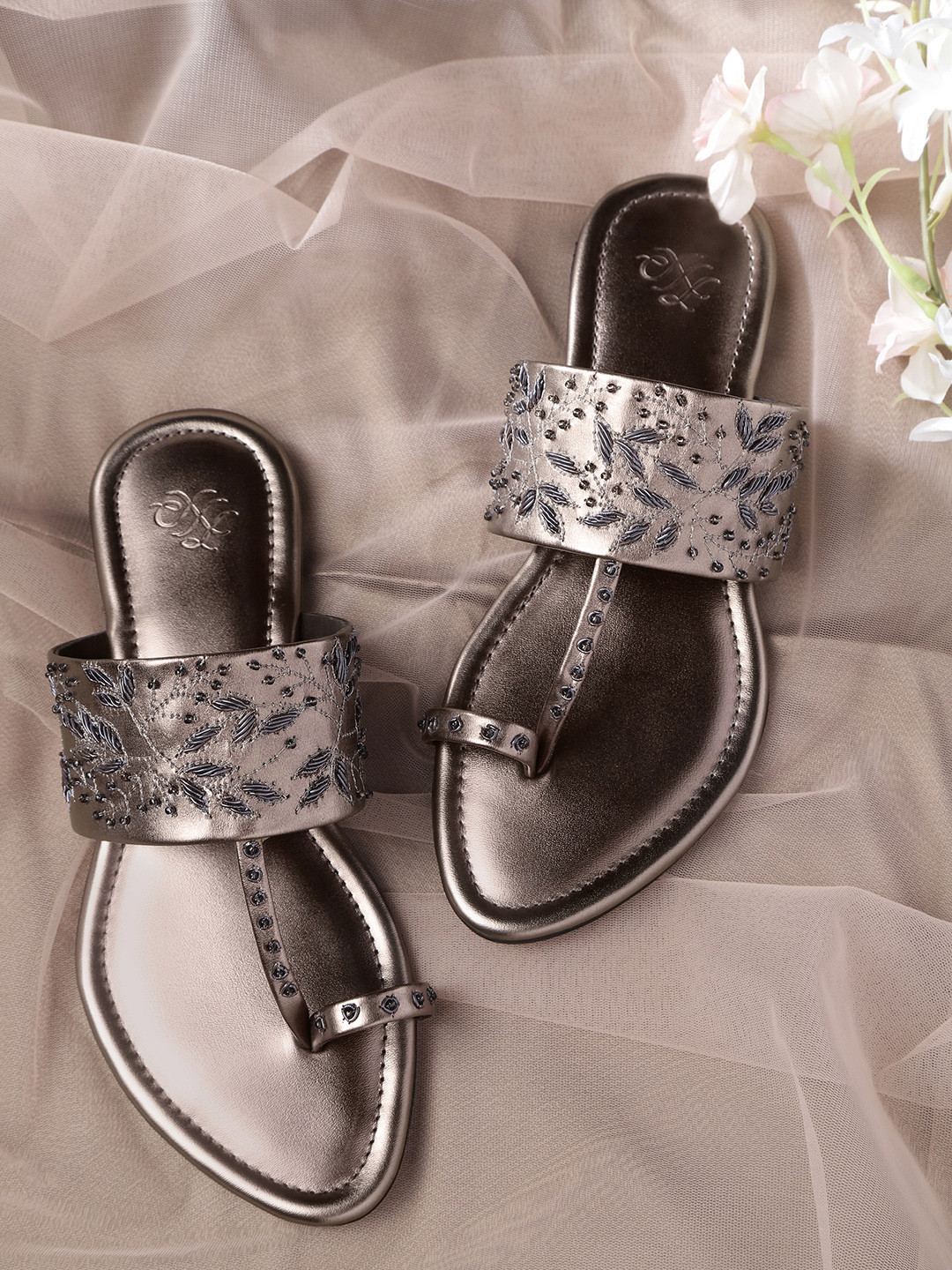 House of Pataudi Women Gunmetal-Toned Embroidered & Beaded Handcrafted One Toe Flats, Metallic 
House of Pataudi Women Gunmetal-Toned Embroidered & Beaded Handcrafted One Toe Flats, Metallic