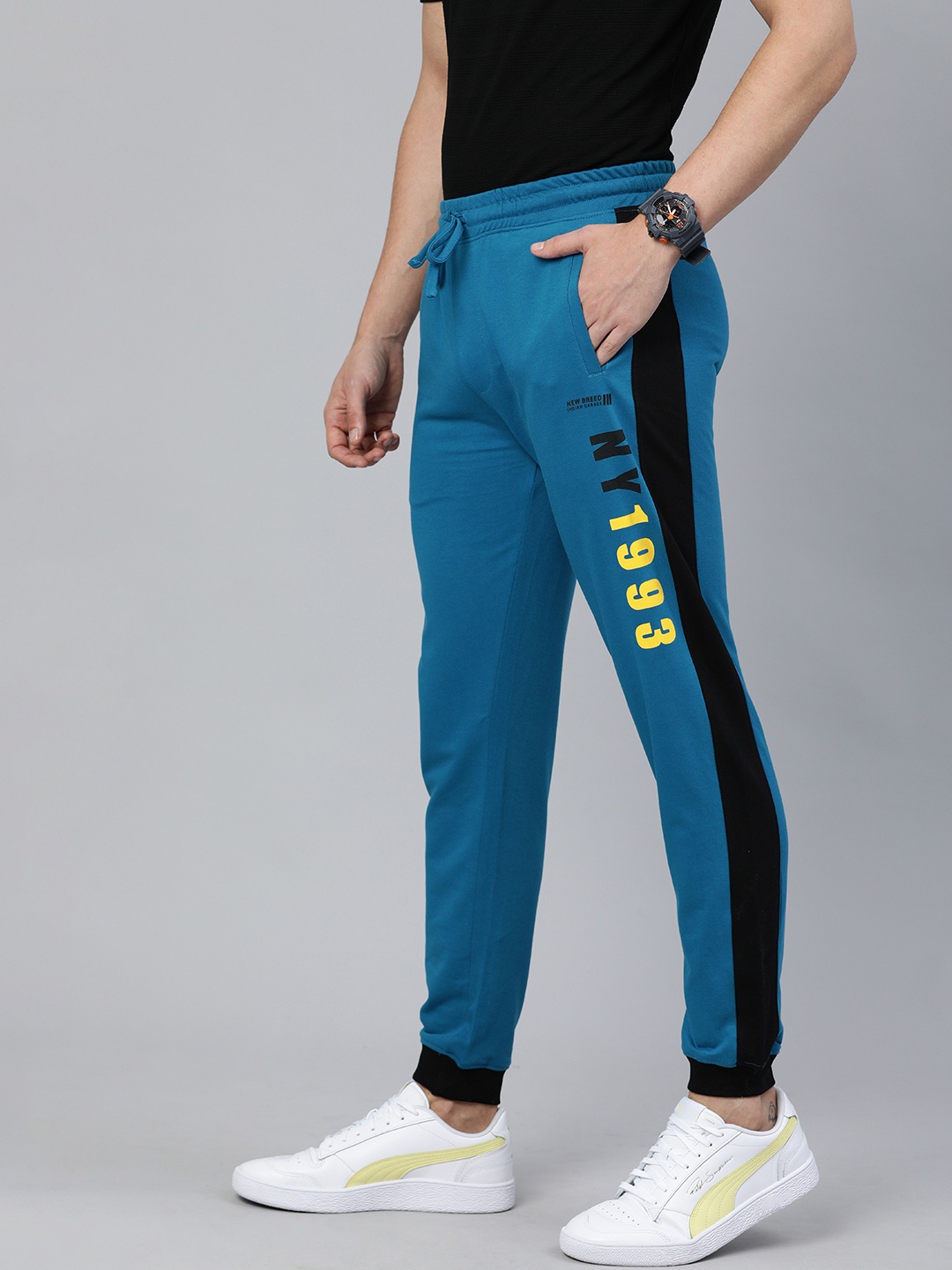 The Indian Garage Co Men Blue Solid Regular Fit Joggers with Print Detail
The Indian Garage Co Men Blue Solid Regular Fit Joggers with Print Detail