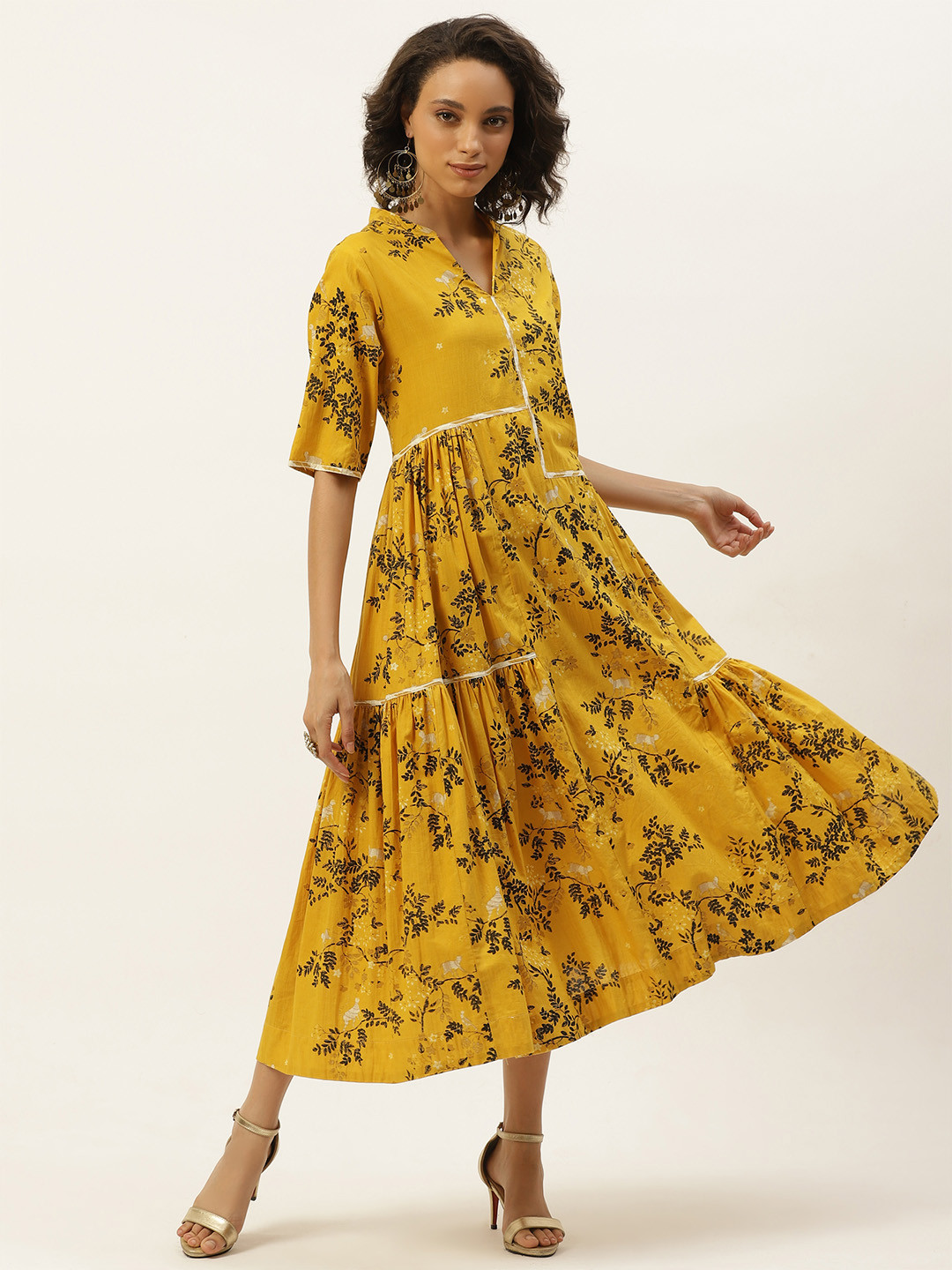 Sangria Women Mustard Yellow & Black Floral Ethnic Tiered Pure Cotton A-Line Dress
Sangria Women Mustard Yellow & Black Floral Ethnic Tiered Pure Cotton A-Line Dress