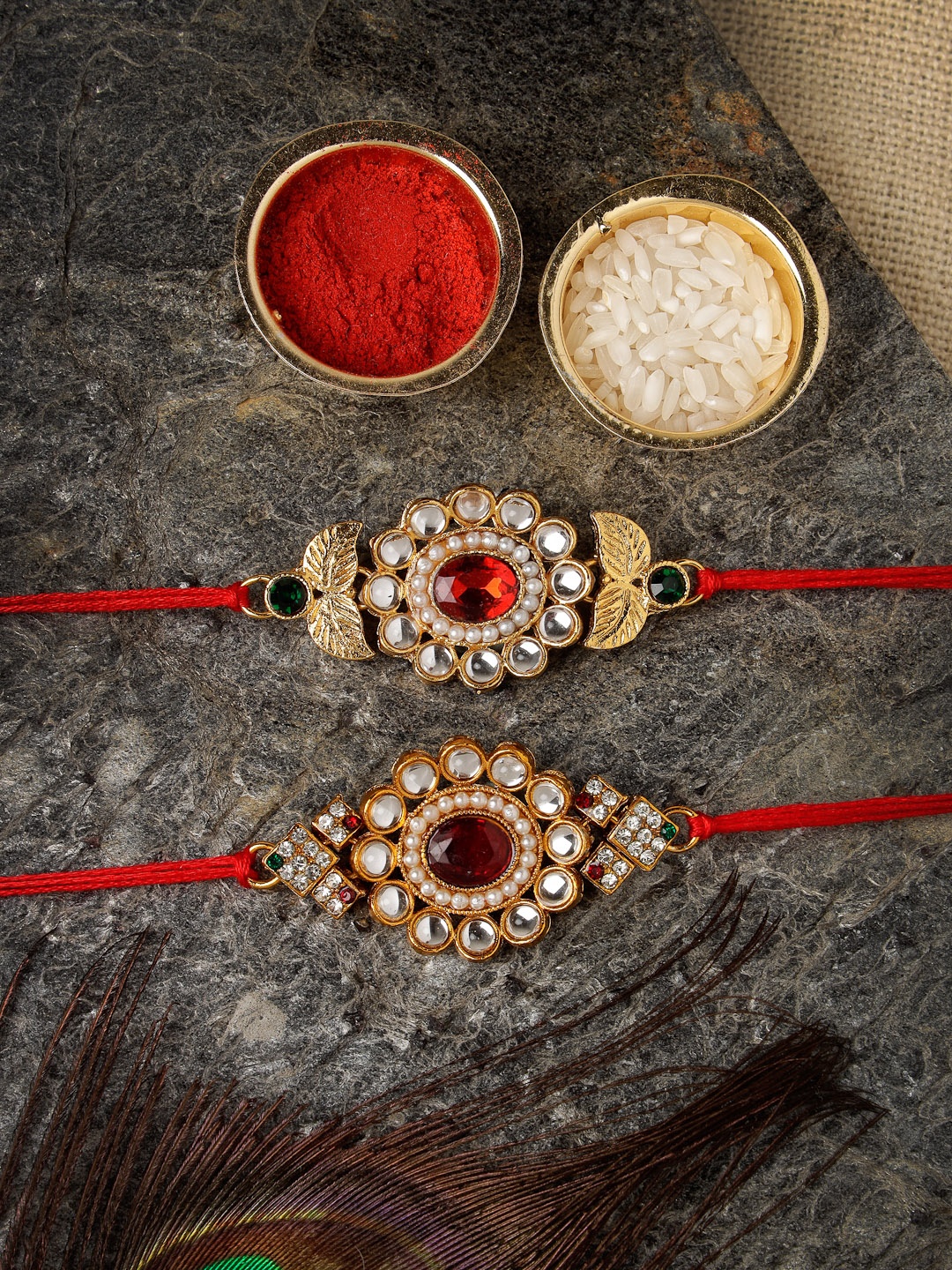 Sukkhi Rakhi Men Set Of 2 Gold-Plated Red & White Stone-Studded Rakhis With Roli Chawal & Raksha Bandhan Greeting Card
Sukkhi Rakhi Men Set Of 2 Gold-Plated Red & White Stone-Studded Rakhis With Roli Chawal & Raksha Bandhan Greeting Card