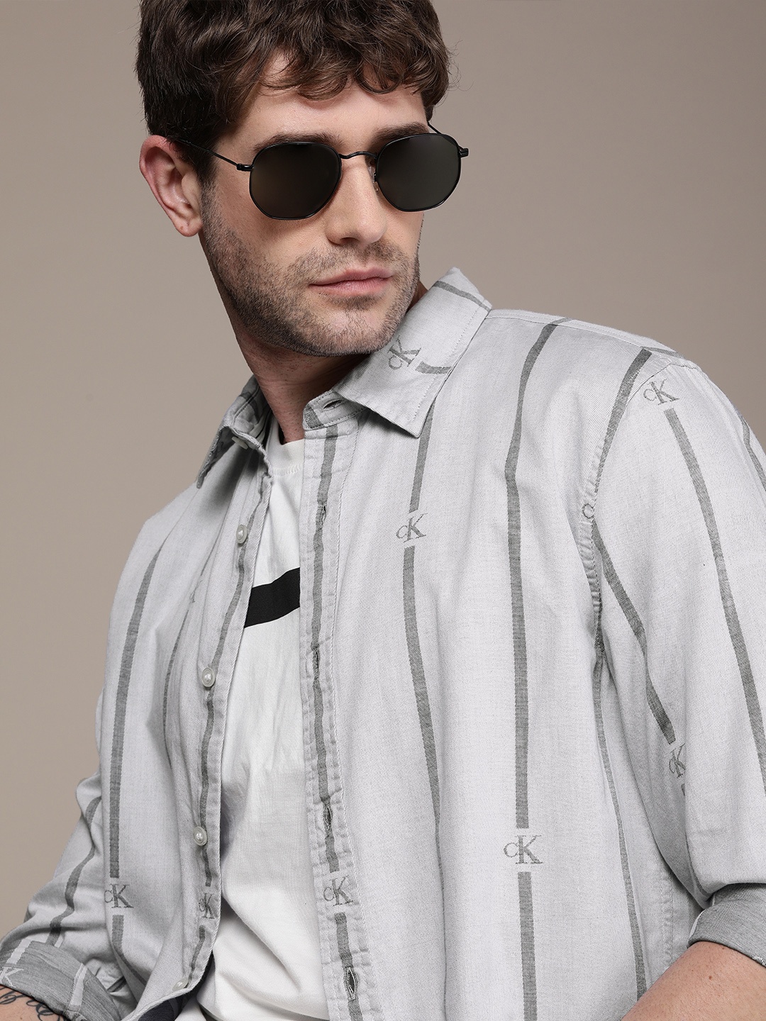 Calvin Klein Jeans Men Off White & Grey Striped Opaque Casual Shirt with Logo Print
Calvin Klein Jeans Men Off White & Grey Striped Opaque Casual Shirt with Logo Print