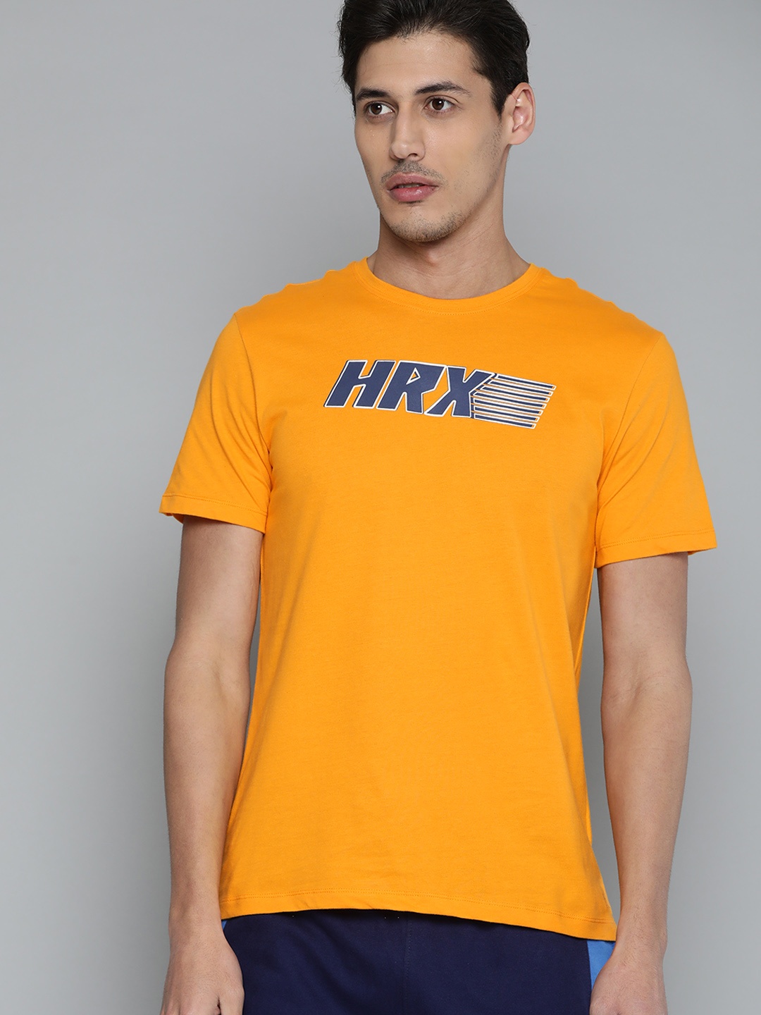 HRX by Hrithik Roshan Men Mustard Yellow & Navy Blue Brand Logo Printed Cotton T-shirt
HRX by Hrithik Roshan Men Mustard Yellow & Navy Blue Brand Logo Printed Cotton T-shirt