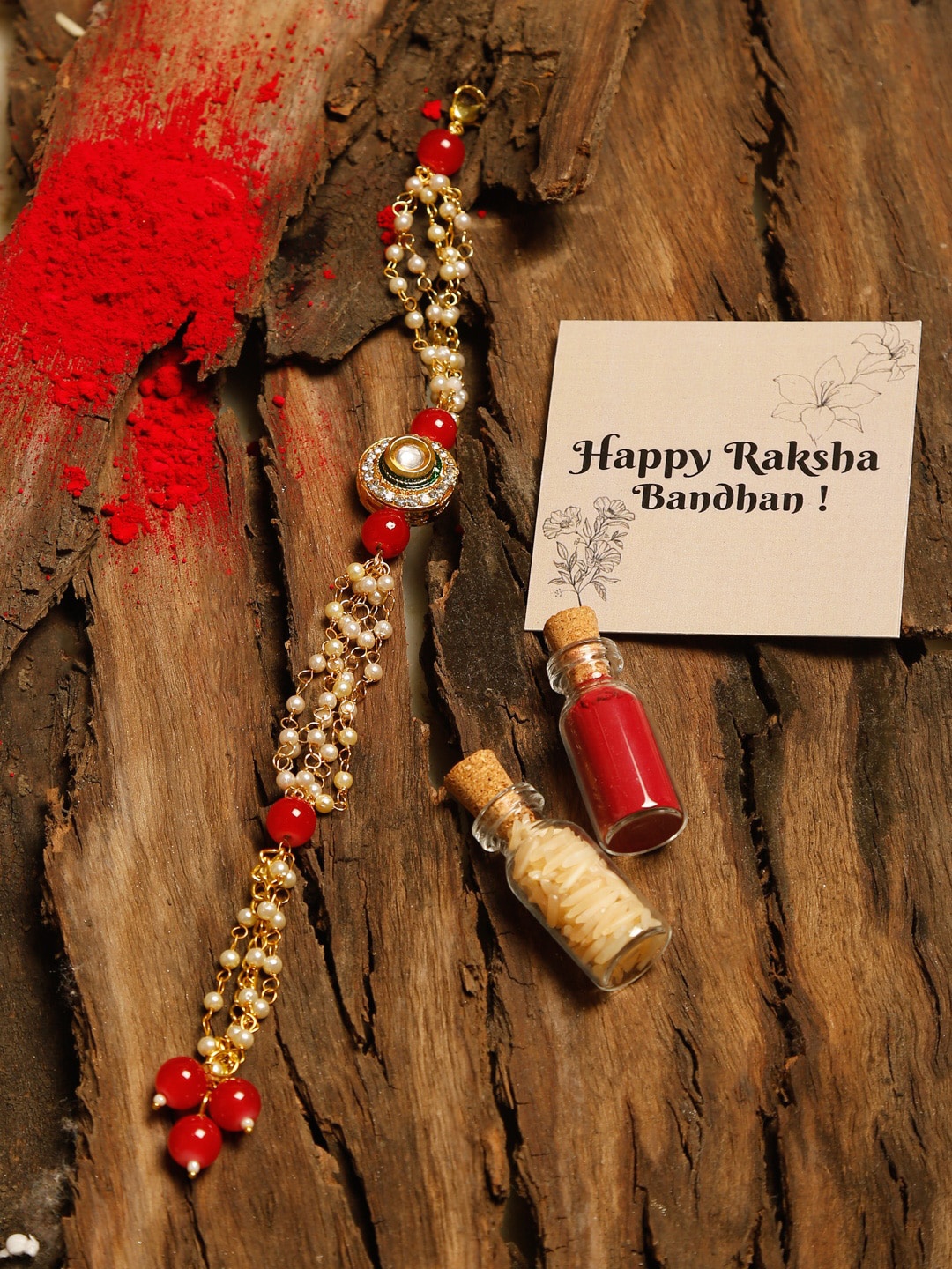 Ruby Raang Red & Gold Kundan Beaded Rakhi Gift Box With Roli, Chawal & Greeting Card
Ruby Raang Red & Gold Kundan Beaded Rakhi Gift Box With Roli, Chawal & Greeting Card
