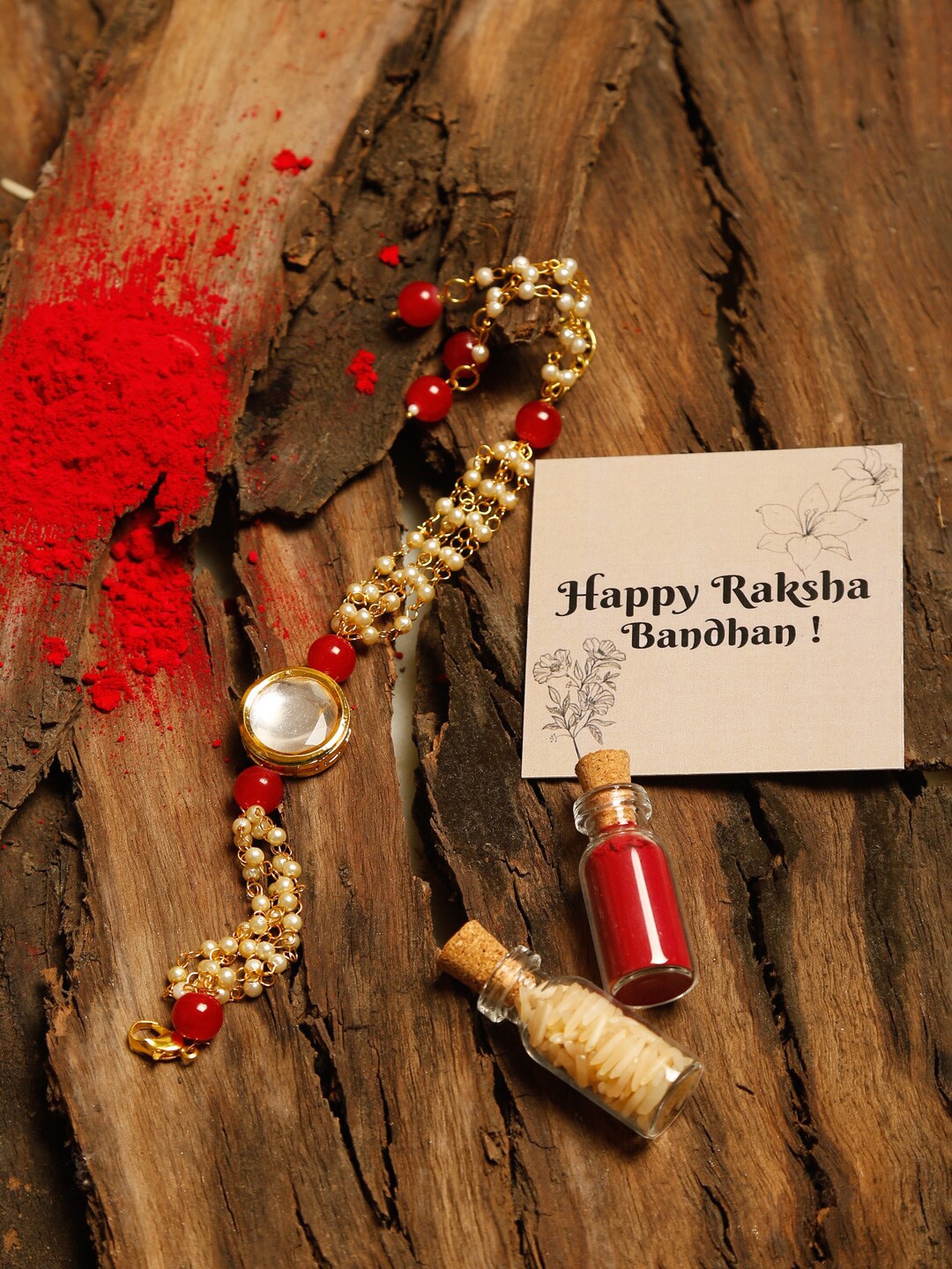 Ruby Raang Red & Gold Kundan Beaded Rakhi Gift Box With Roli, Chawal & Greeting Card
Ruby Raang Red & Gold Kundan Beaded Rakhi Gift Box With Roli, Chawal & Greeting Card