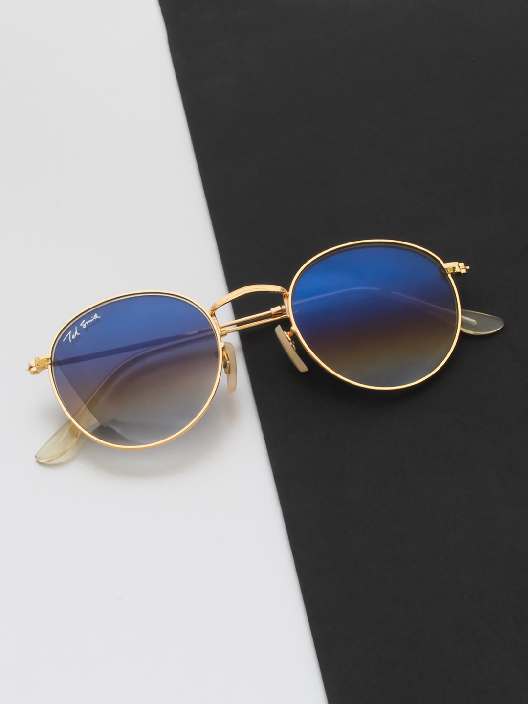 Ted Smith Unisex Blue Lens & Gold-Toned Round Sunglasses with UV Protected Lens MOON_C15
Ted Smith Unisex Blue Lens & Gold-Toned Round Sunglasses with UV Protected Lens MOON_C15