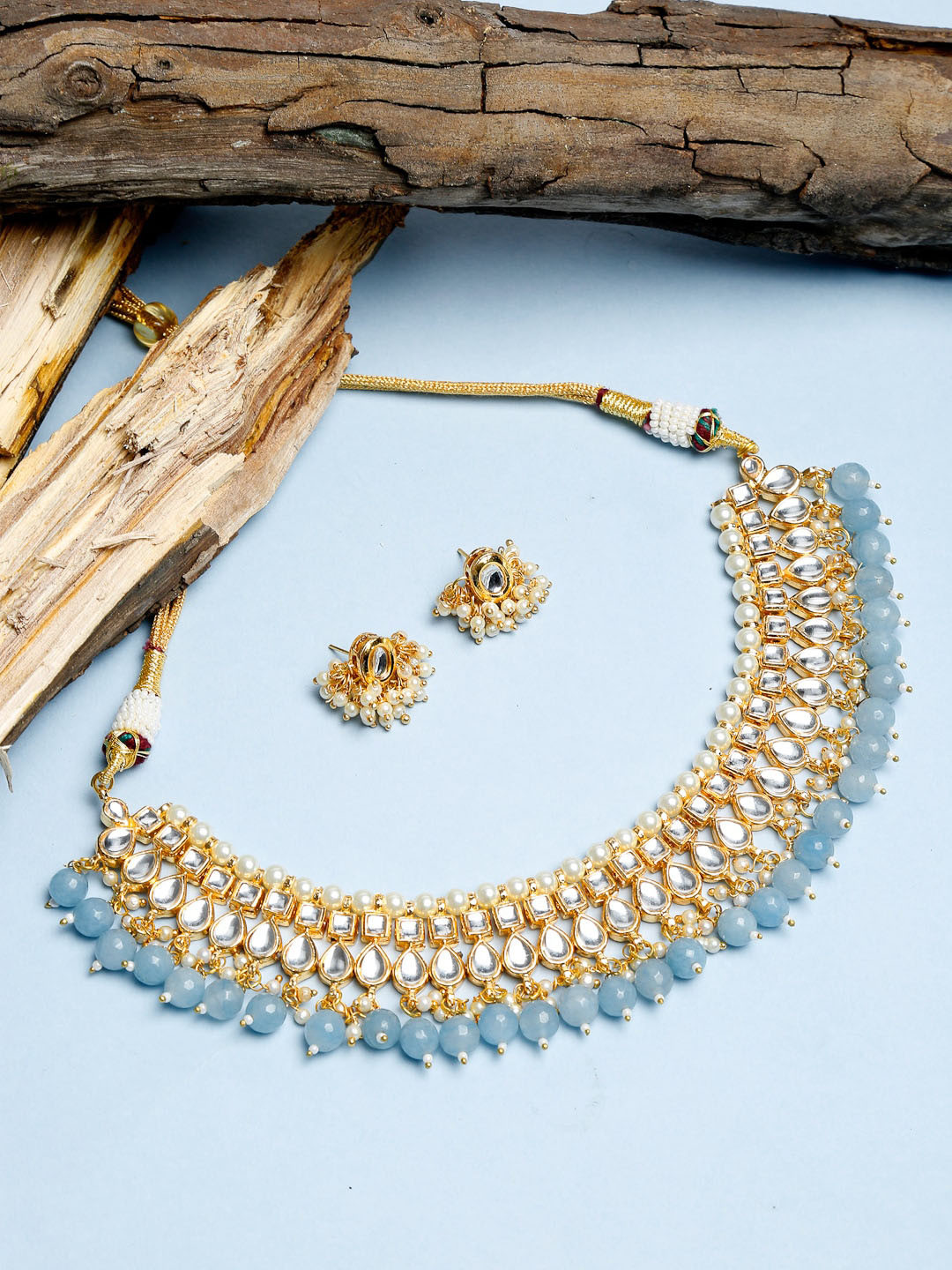 Ruby Raang Gold-Plated White & Blue Kundan Pearl Beaded Choker Jewellery Set
Ruby Raang Gold-Plated White & Blue Kundan Pearl Beaded Choker Jewellery Set