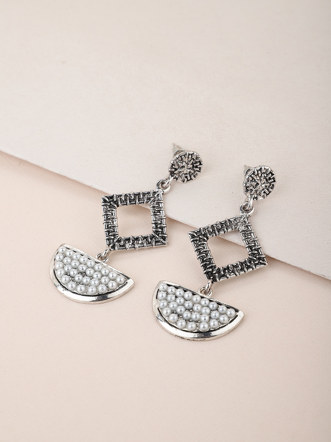 Carlton London Silver-Toned & White Rhodium-Plated Oxidised Beaded Geometric Drop Earrings
Carlton London Silver-Toned & White Rhodium-Plated Oxidised Beaded Geometric Drop Earrings